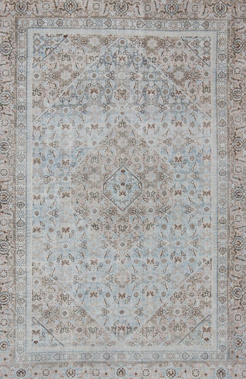 Stylized Persian Antique Tabriz Rug with Medallion Design and Muted Colors In Good Condition For Sale In Atlanta, GA