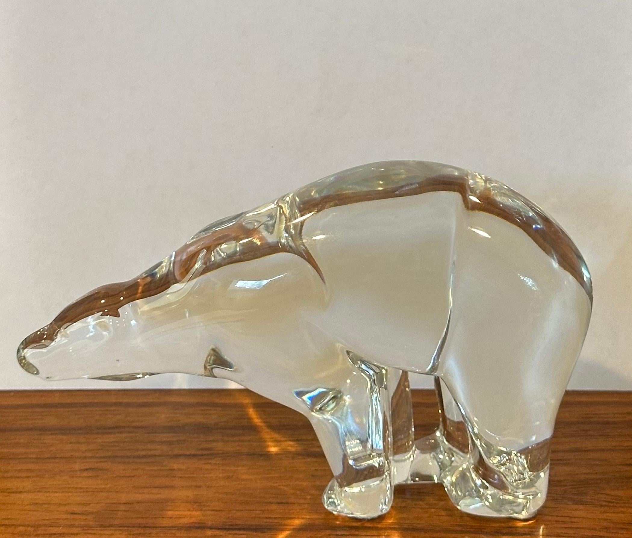 Gorgeous stylized polar bear sculpture by Baccarat, circa 1990s. The piece is in excellent condition with no visible imperfections and has great clarity. Signed on the underside, the piece measures 6.5