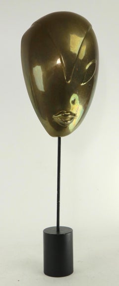 Stylized Woman's Face Sculpture on Stand