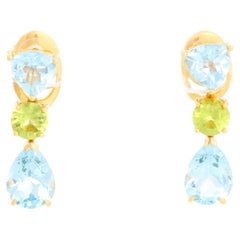 Suarez, boucles d'oreilles en or jaune 18 carats, topaze bleue et péridot