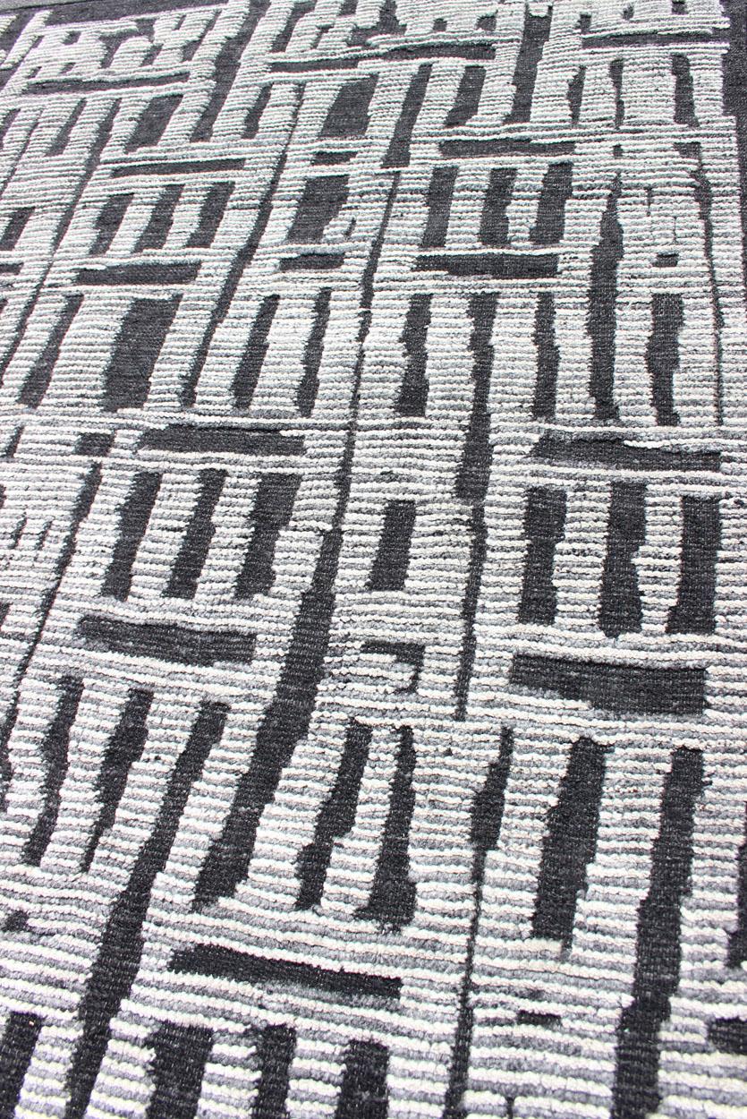 Sub-Geometric Abstract Design Modern Casual Rug in Black and Cream. Country of Origin: India; Type: Modern, Minimal; Design: Diamond, Stripes, Abstract; Keivan Woven Arts: rug IN-ILM-1462.
Measures: 8'3 x 9'7 
This unique piece features asymmetrical