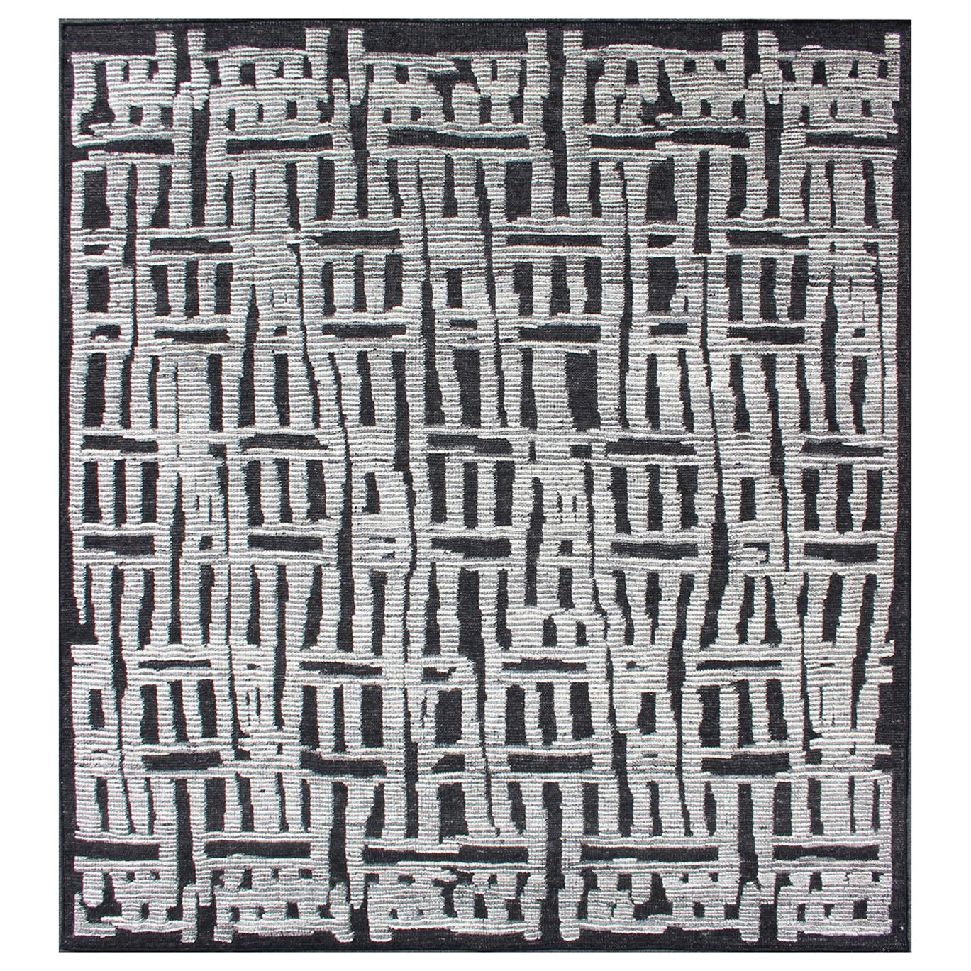 Tappeto sub-geometrico dal design astratto e moderno in nero e panna
