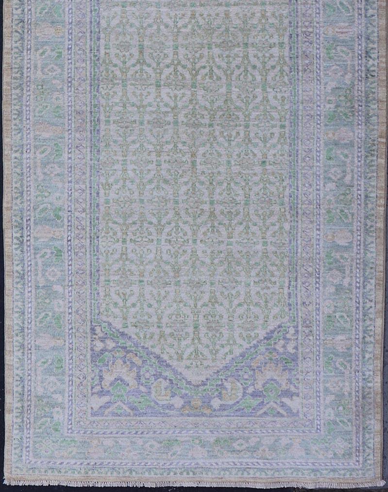 Wool Sub-Geometric Paisley Designed Rug with Muted Tones of Yellow-Green and Brown For Sale