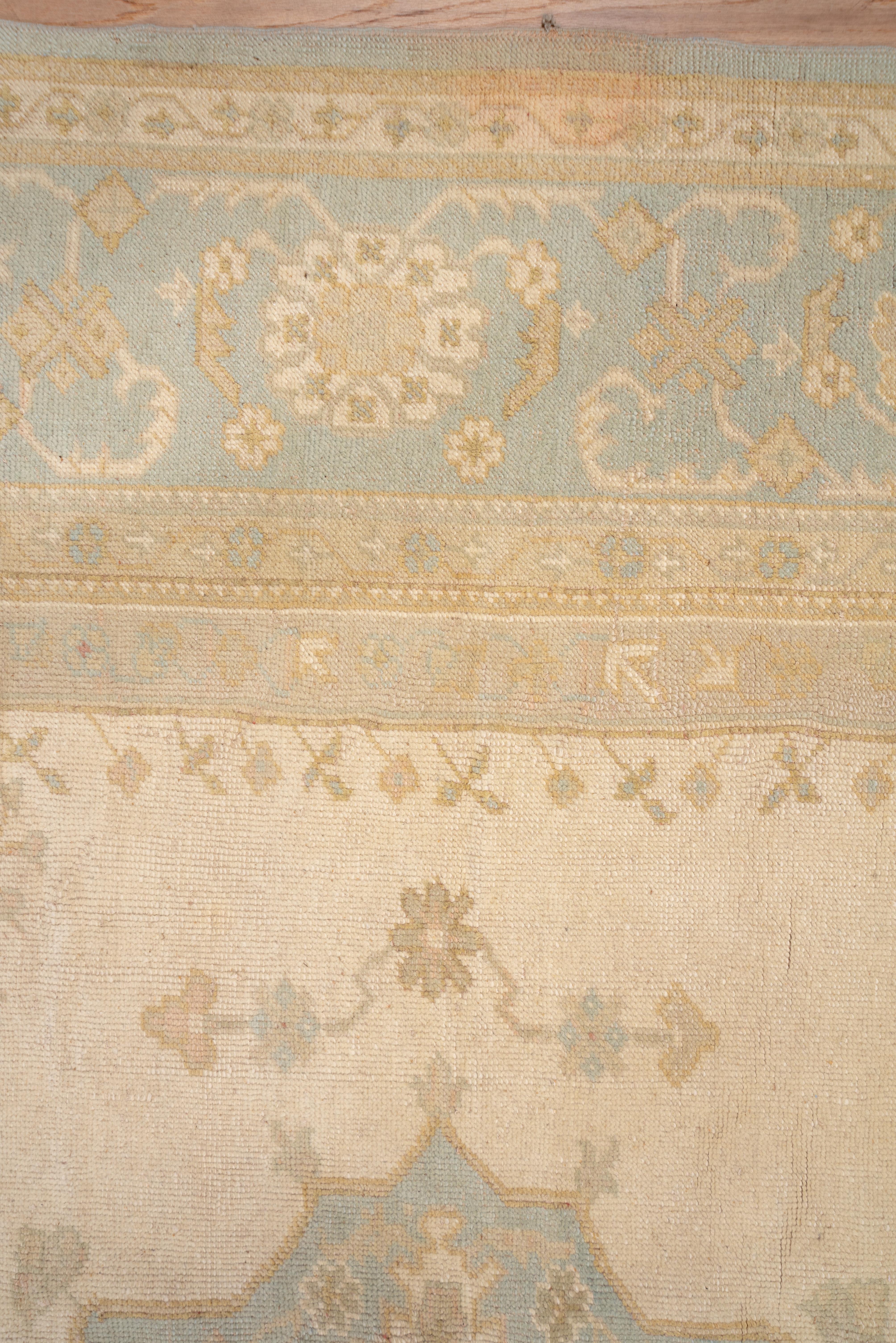 Hand-Knotted Subdued Antique Oushak Carpet, circa 1910s For Sale