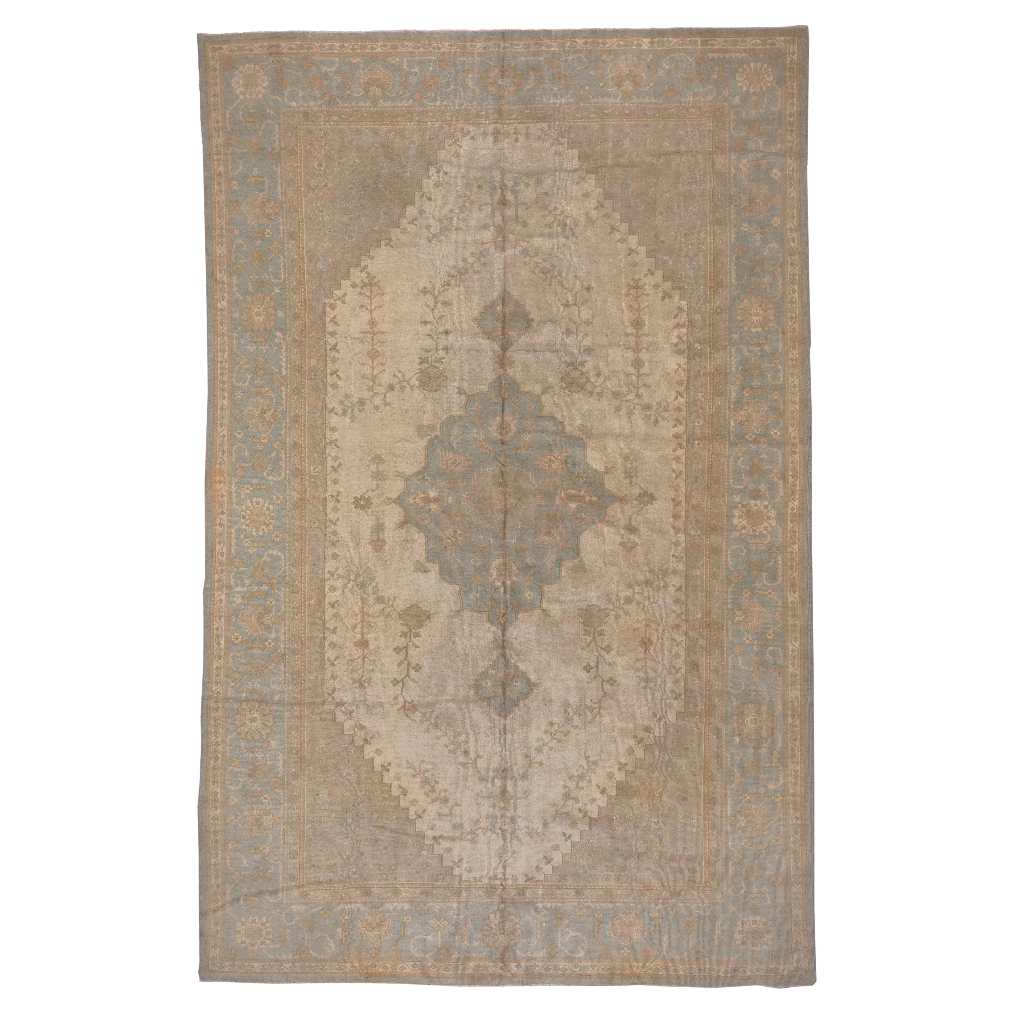 Subdued Antique Oushak Carpet, circa 1910s For Sale