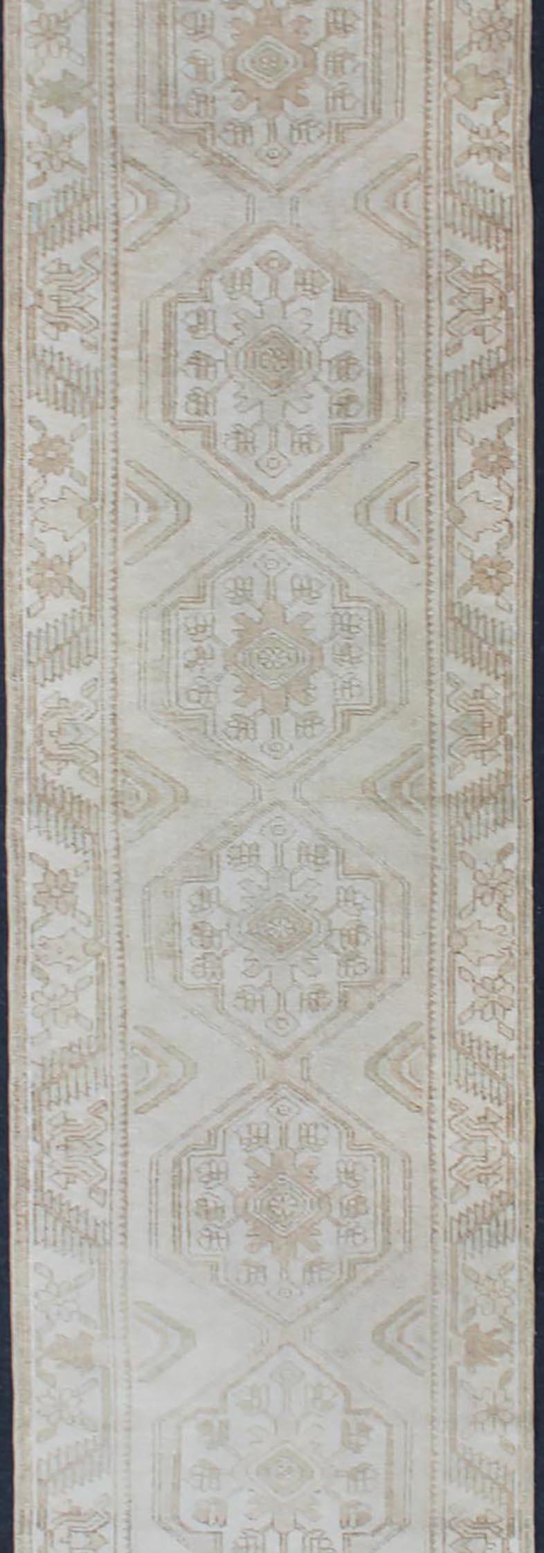 Subdued Vintage Turkish Oushak Runner with Medallions in Soft Cream In Good Condition For Sale In Atlanta, GA