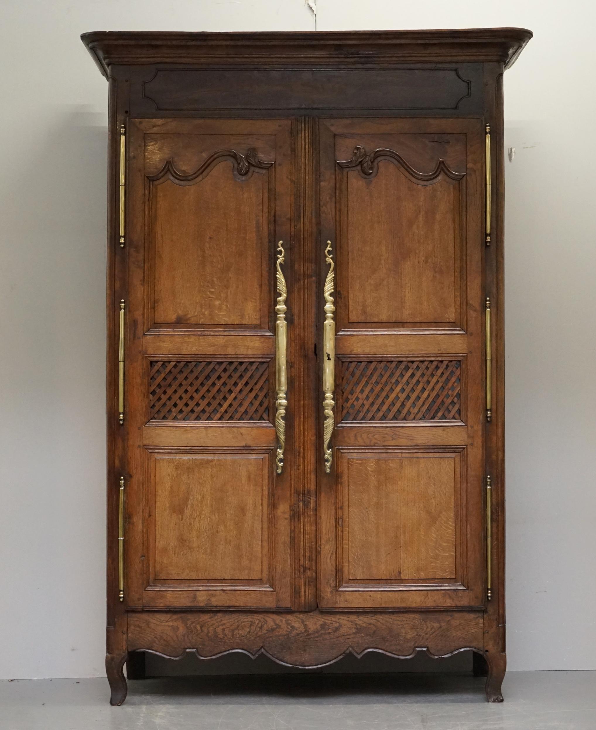 We are delighted to offer for sale this sublime circa 1780 late 18th century French oak with oversized brass fittings armoire or pot cupboard 

A very good looking and well made piece. Designed as an armoire for folded linens, used largely these