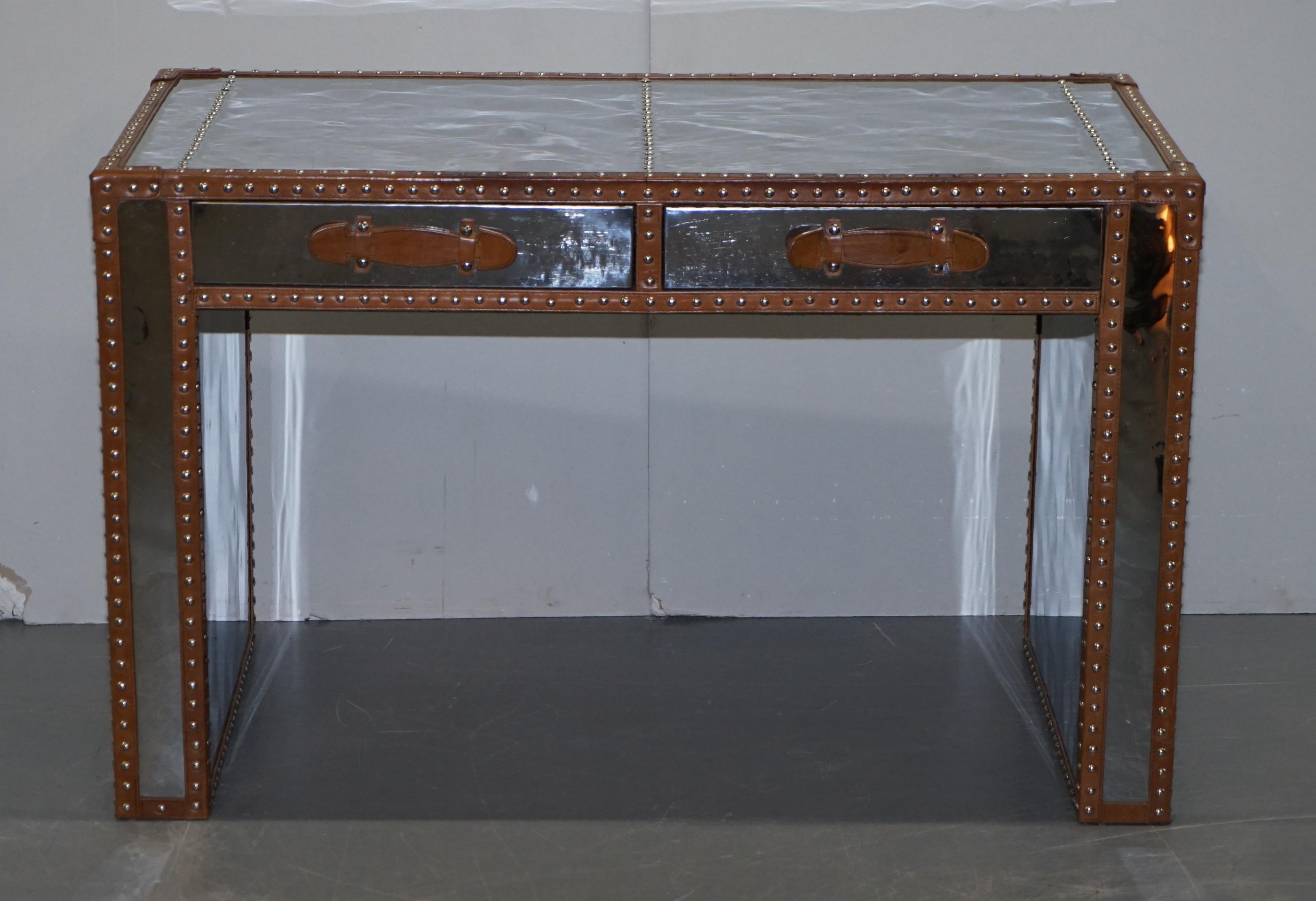 We are delighted to offer for sale this lovely Andrew Martin chrome and leather luggage Military Campaign style desk

A very good looking well made and decorative writing table. The frame is polished chrome and has a mirror finish as do all the