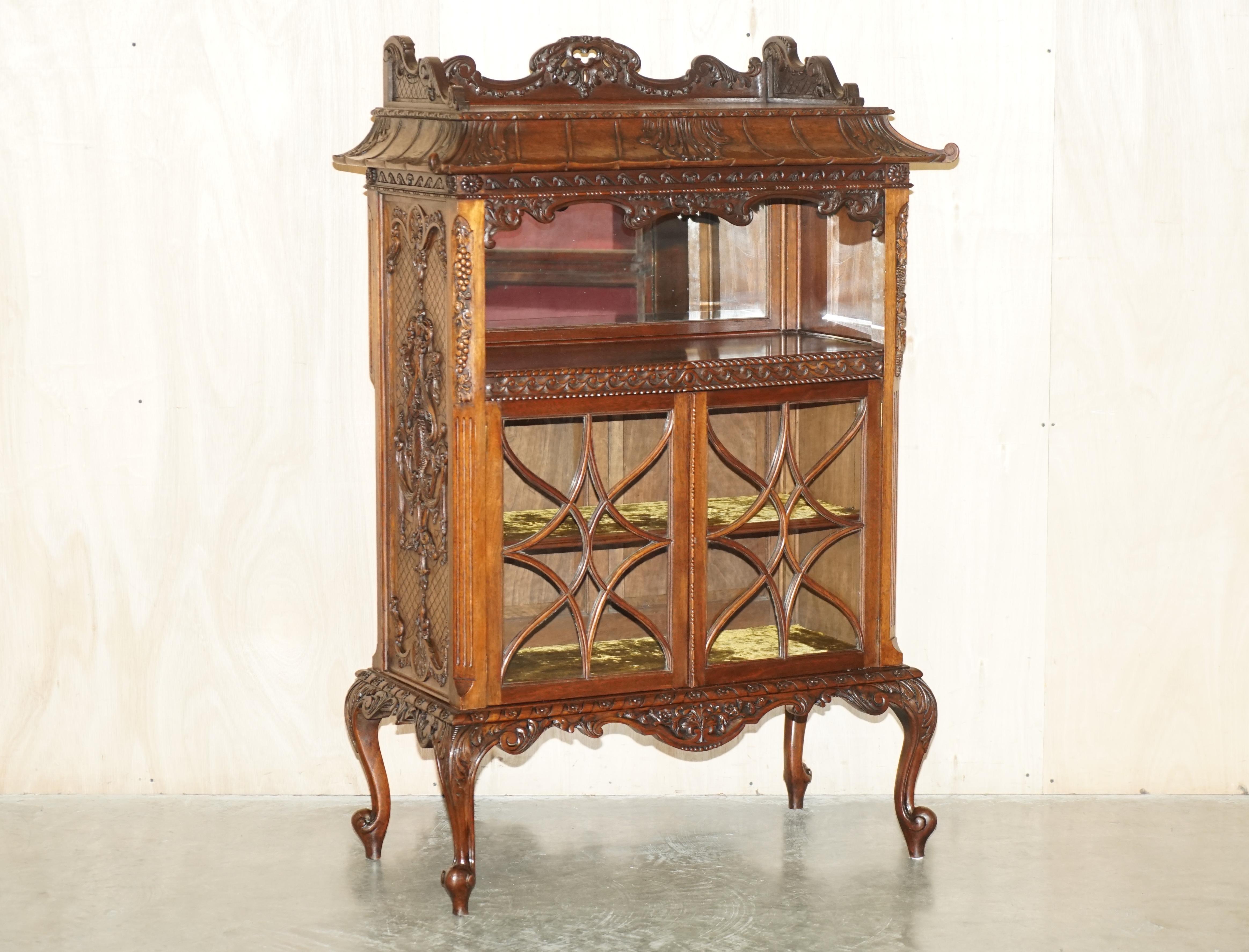 Royal House Antiques is delighted to offer for sale this absolutely exquisite Thomas Chippendale style, Pagoda top, display cabinet with Astral Glazed doors 

Please note the delivery fee listed is just a guide, it covers within the M25 only for the