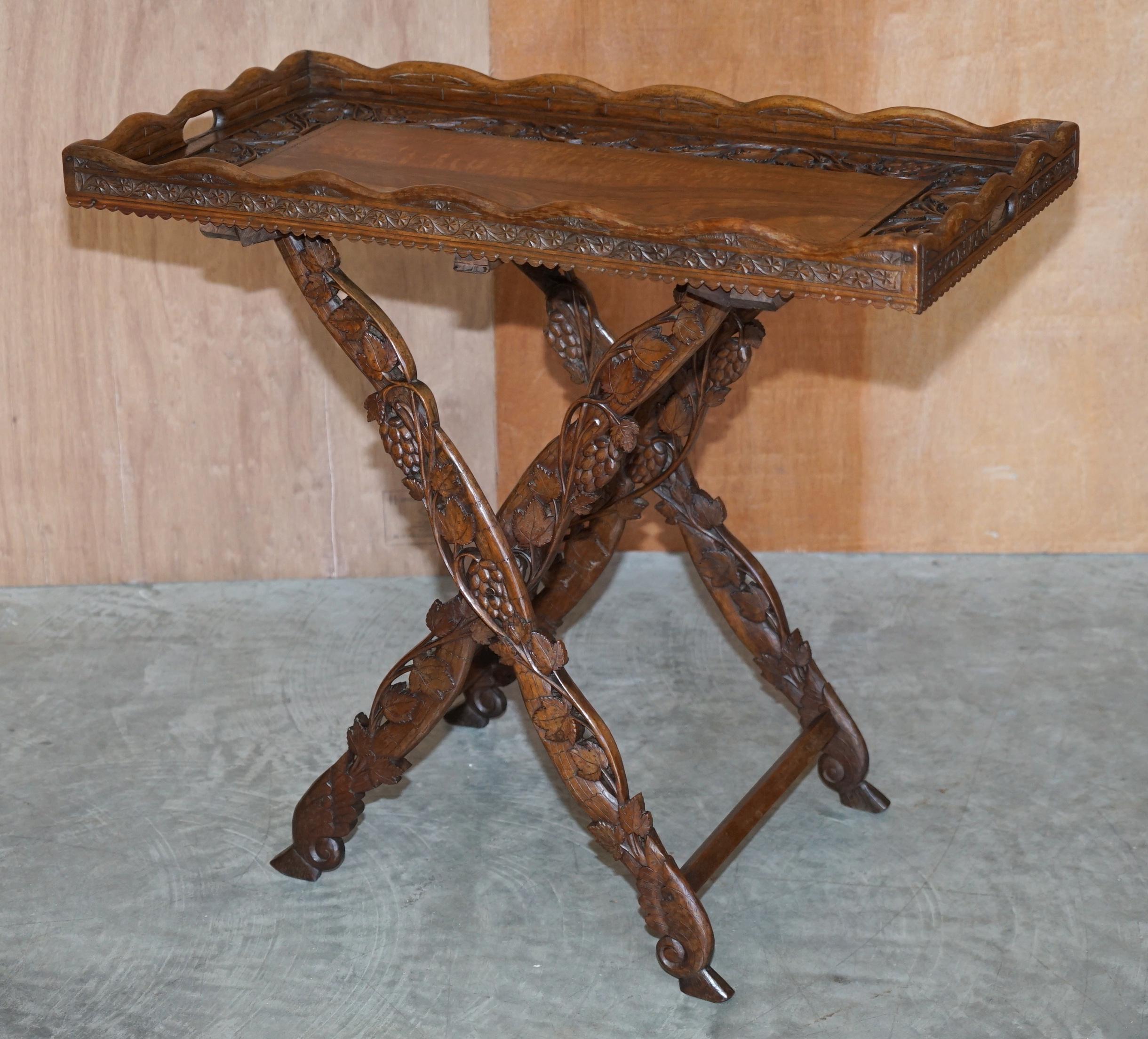We are delighted to offer this very well made antique circa 1880 Anglo Indian Rosewood hand carved serving tray table that folds away

A very good looking and well made piece. This was produced during the British occupation of India, the natives
