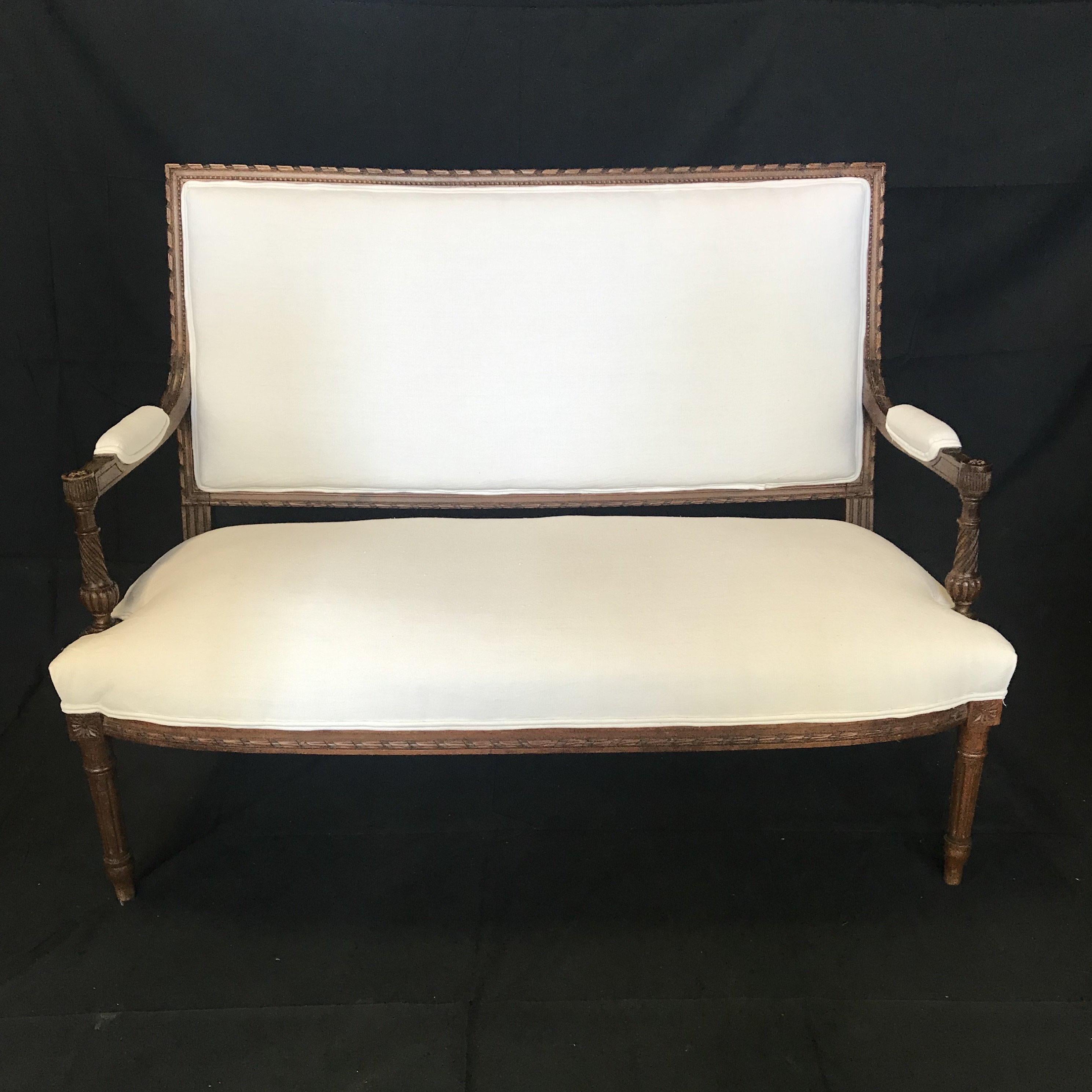 Very elegant sophisticated French Louis XVI carved 5-piece salon set including square back loveseat, 2 armchairs with open arm rests, and 2 side chairs. All are reupholstered in immaculate vintage French linen cotton sheet material. The carved