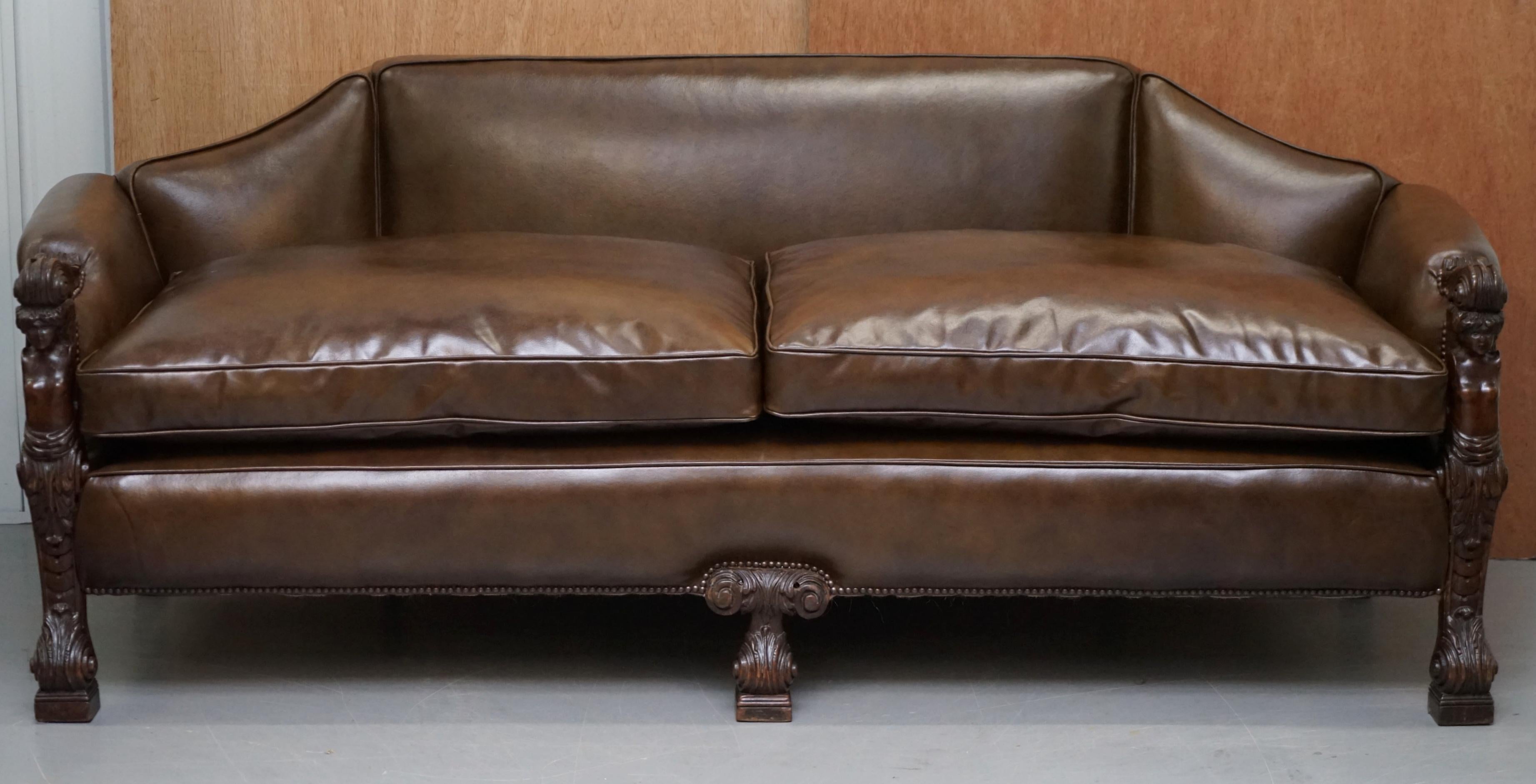 We are delighted to this very rare fully restored Regency circa 1810 brown leather sofa with hand carved mahogany herms statues

A one of kind piece, this original Regency sofa is simply put a work of art. The carvings to the arms represent Herms