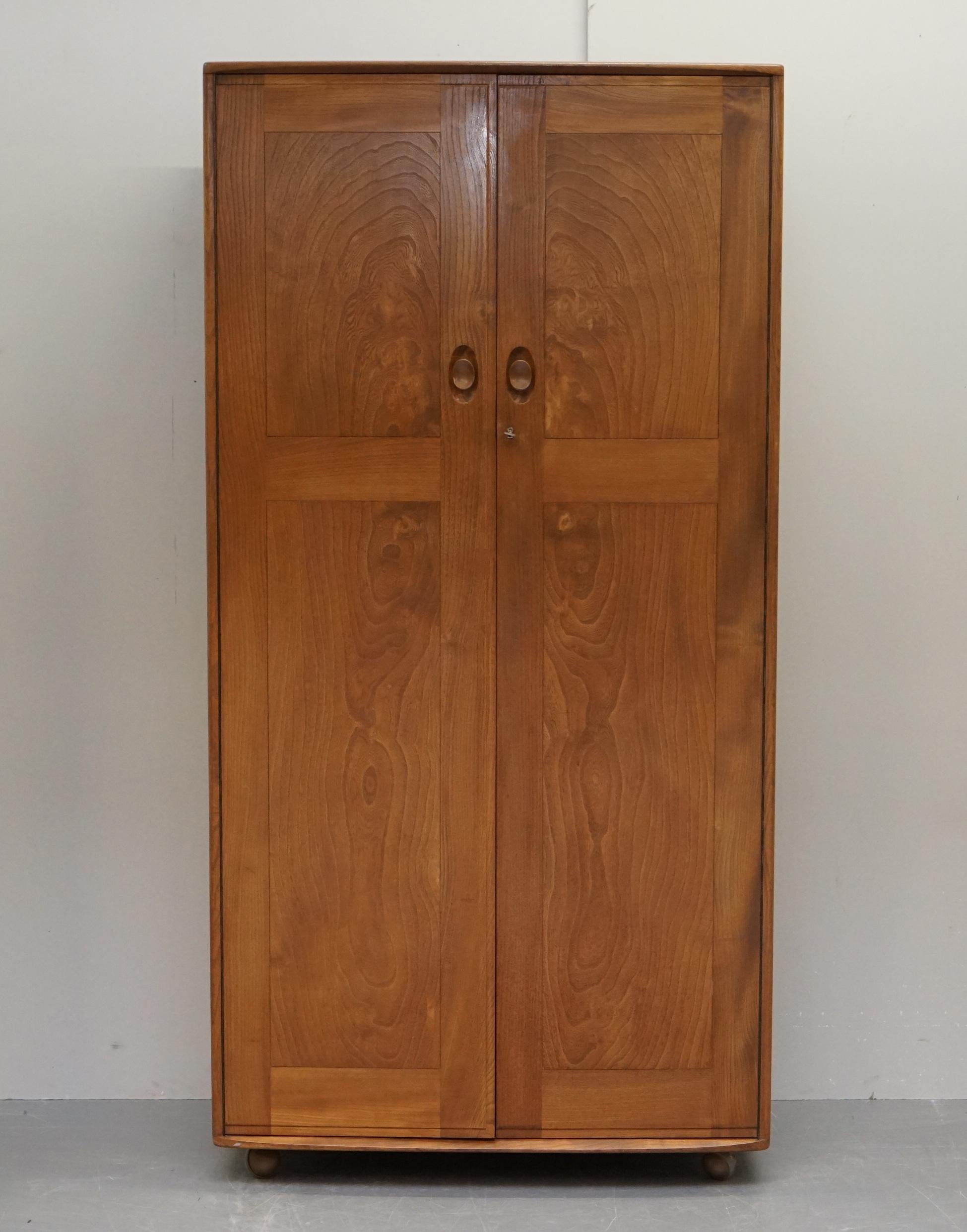 We are delighted to offer for sale this stunning original circa 1960s G-Plan Ercol solid Elm wardrobe which is part of a large suite

This piece is in perfect and I mean absolutely perfect condition, you will be hard pressed to find a single sign