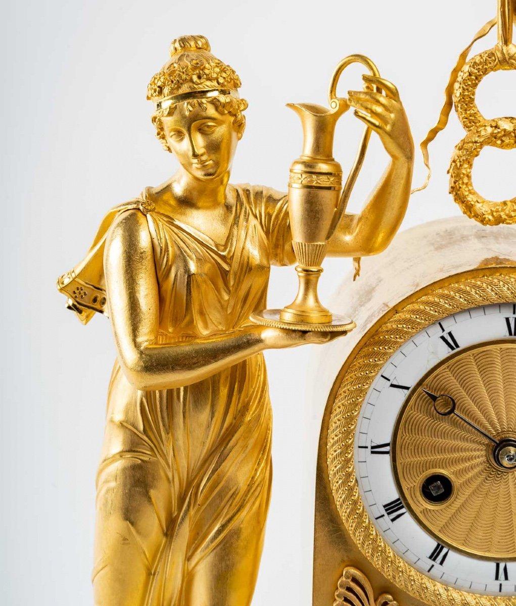 Sublime gilded bronze clock representing Goddess Hera 
The mercury gilding is original. The dial is white enamelled and the hours are written in Roman numerals.
Restoration period
Measures: H: 48,5 cm, W: 34,5 cm, D: 12,5 cm
Original mechanism