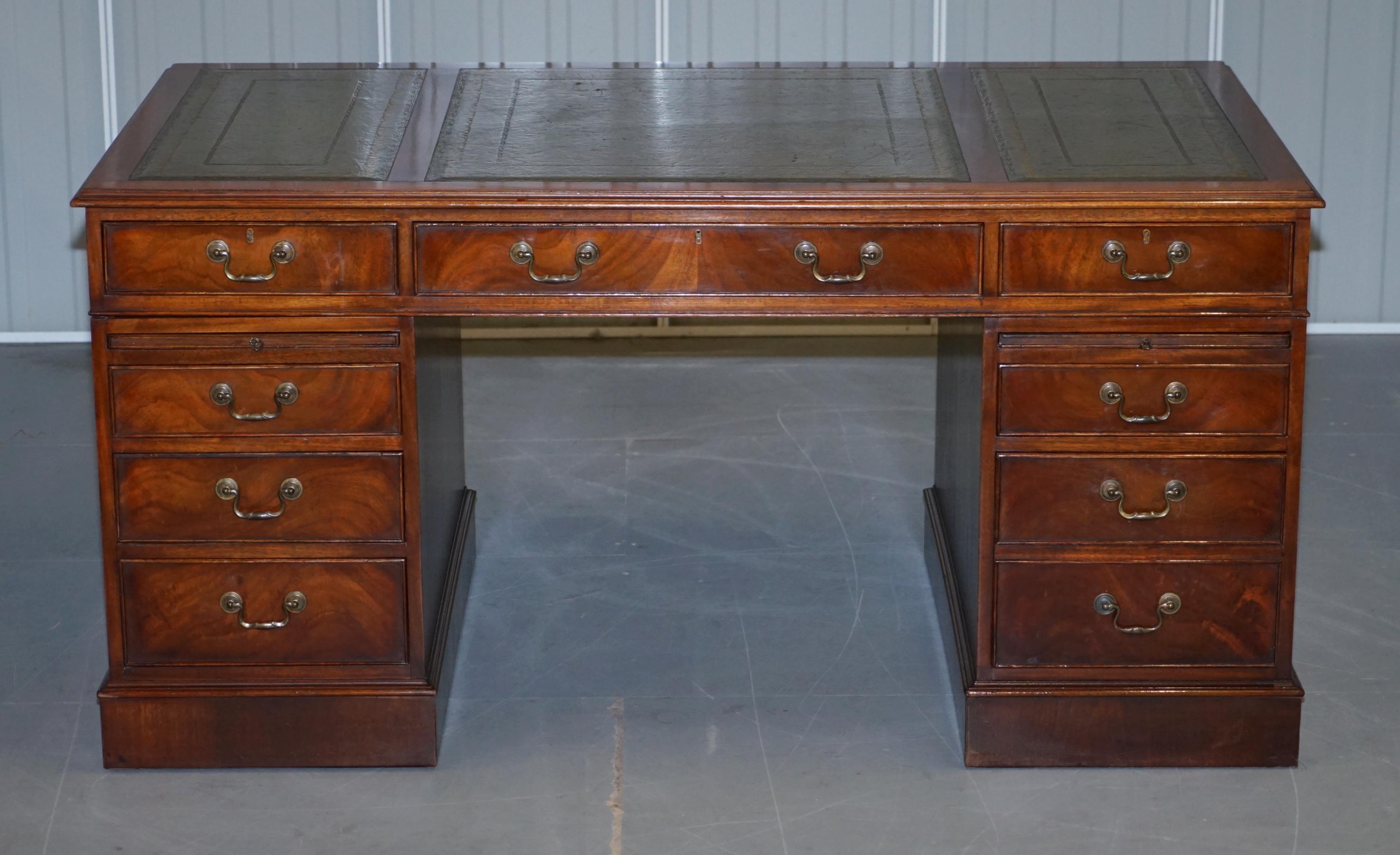 We are delighted to offer for sale this exquisite vintage hand made mahogany twin pedestal partner desk with green leather top and double butlers serving trays

A beautiful, desirable and a very unique piece, the desk is made with a lovely grain