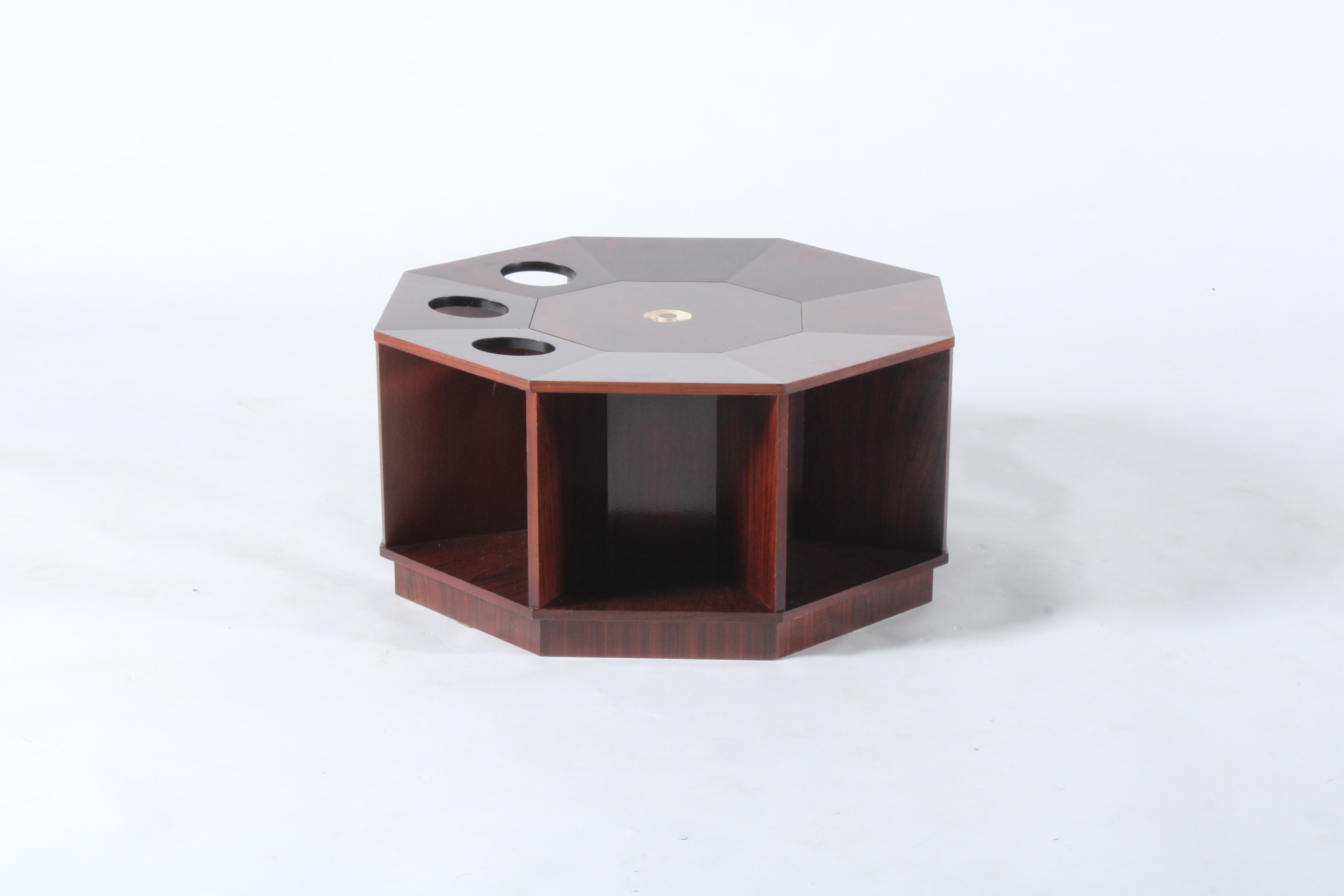 A stunning original octagonal mid century Italian coffee/cocktail table dating from the 1950's and a piece that we sourced from a private collection in the beautiful city of Milan. A beautiful and unusual design featuring a central removable lid