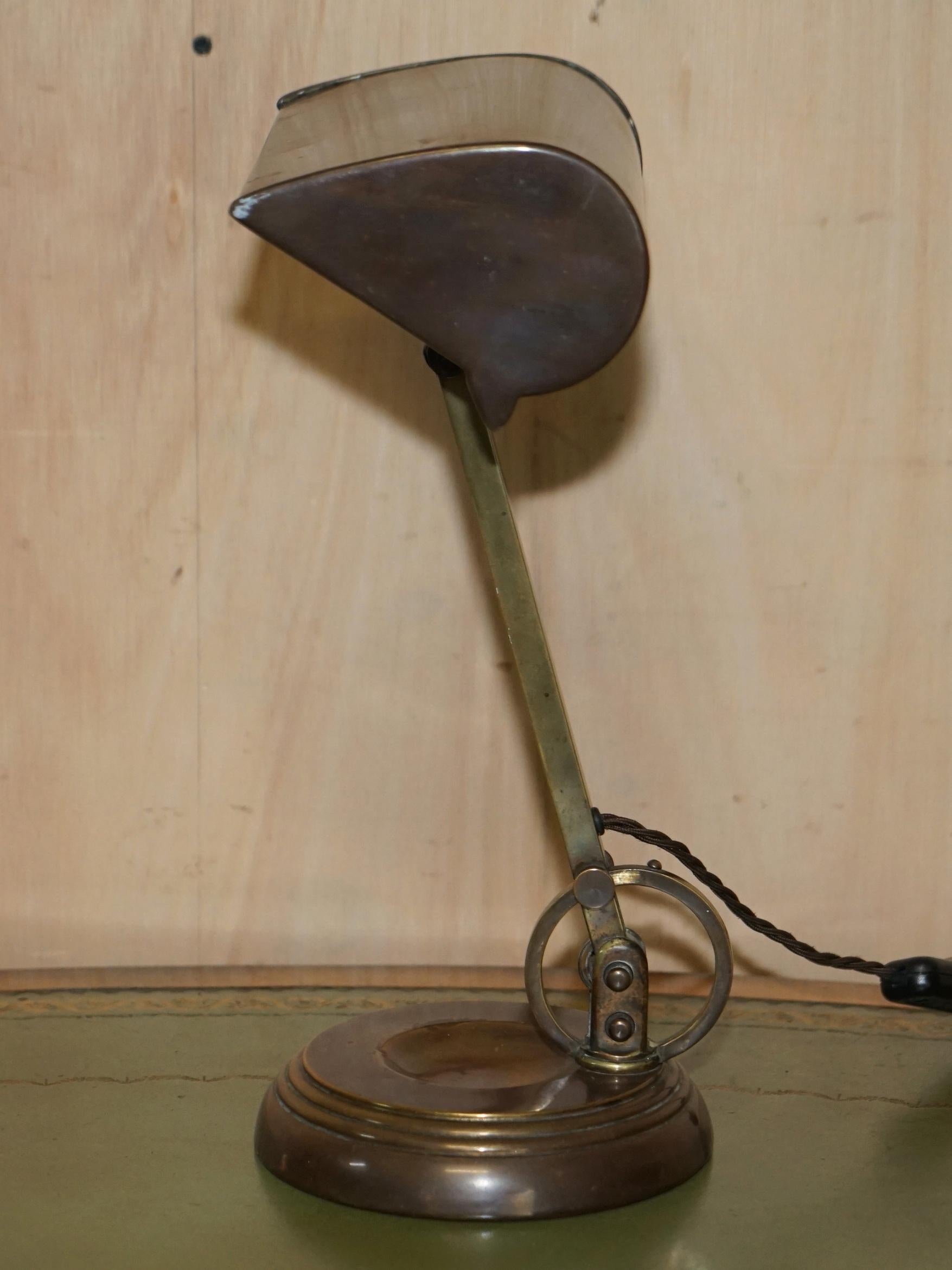 We are delighted to offer for sale this stunning vintage Bronze, Brass and Copper with Art Deco bankers lamp circa 1920 with single point articulation 

A very good looking and decorative piece, the lamp has a very industrial style angle