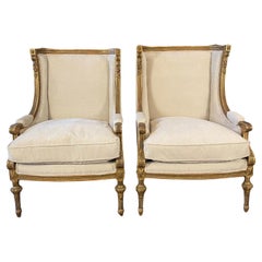 Sublime Pair of Restored French His & Hers Carved Gilded Walnut Lounge Chairs