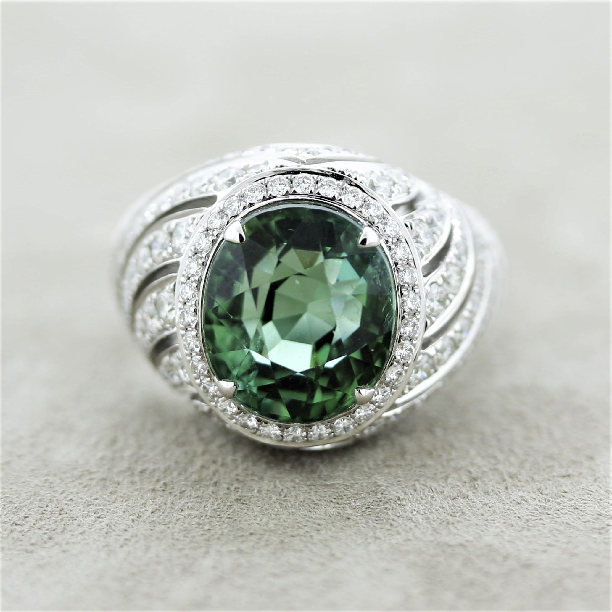 Simply gorgeous! The ring mains a 9.58 carat Paraiba tourmaline with a rich scintillating electric bluish-green color which the best Paribas are known for. It has a lovely oval-shape and a beautiful polish. It is complemented by 2.10 carats of round