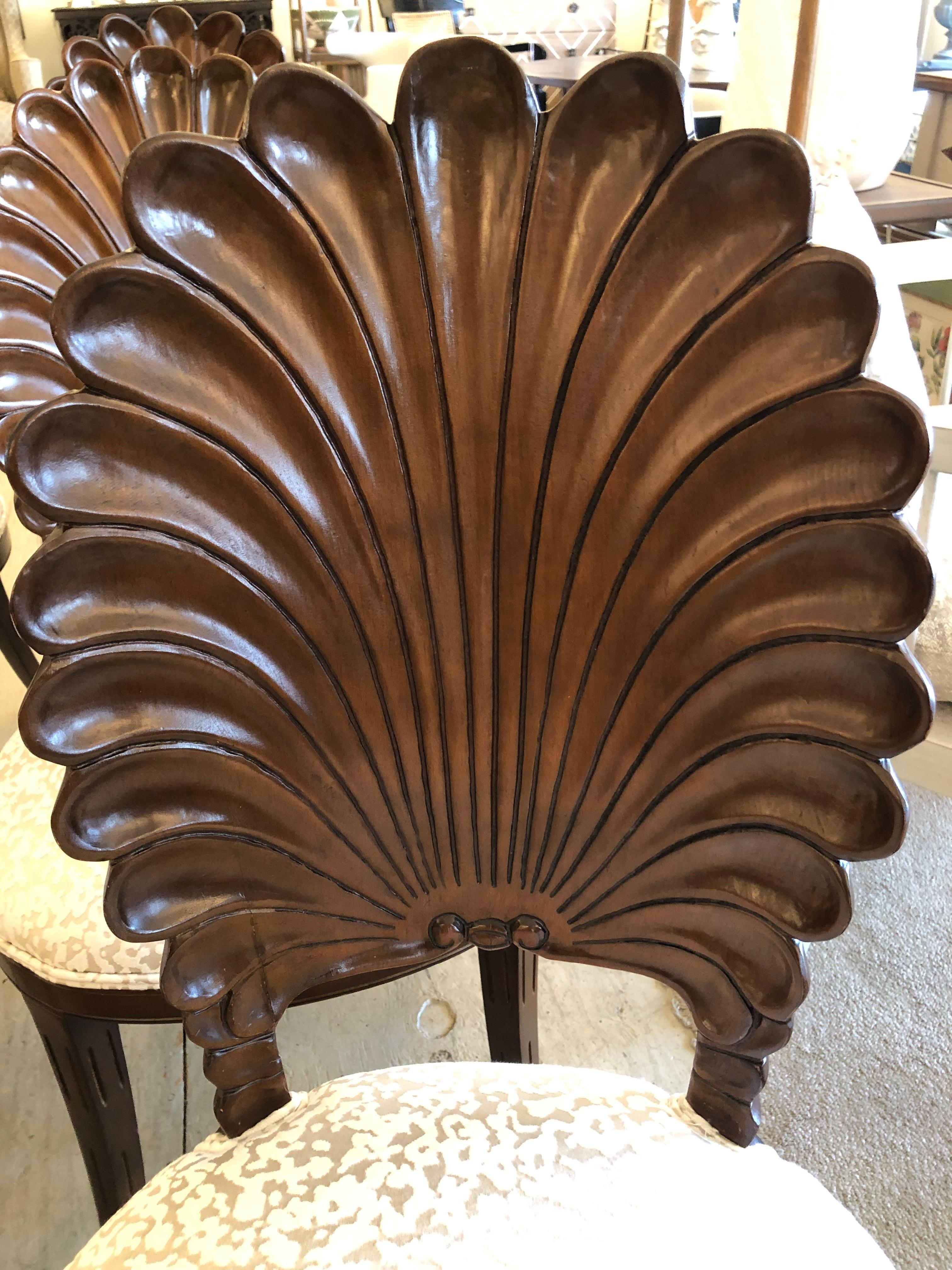 Sublime newly restored rich carved walnut shell back Grotto chairs newly upholstered in an elegant ivory coral motif velvet that compliments the dark wood beautifully. The scalloped sculpted backs are lovely front and back and very comfortable.