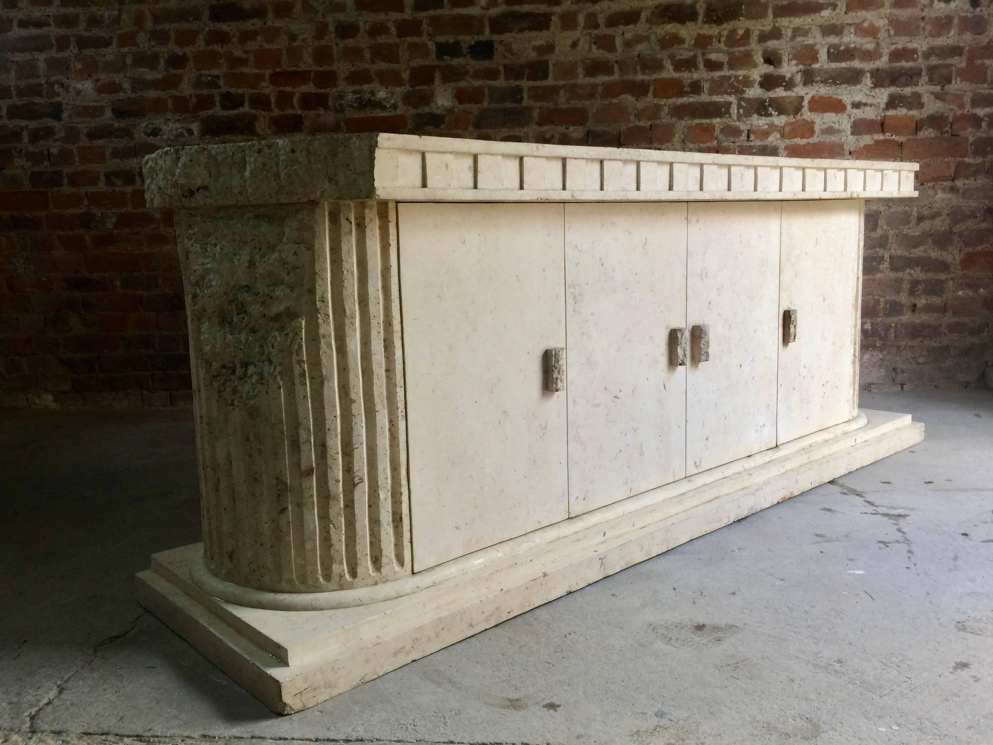 A fabulous 20th century 'Greek Parthenon' style composite marble sideboard credenza with distressed fluted column sides, fitted with four doors enclosing shelves within, raised on a stepped plinth base, an incredibly beautiful and individual piece