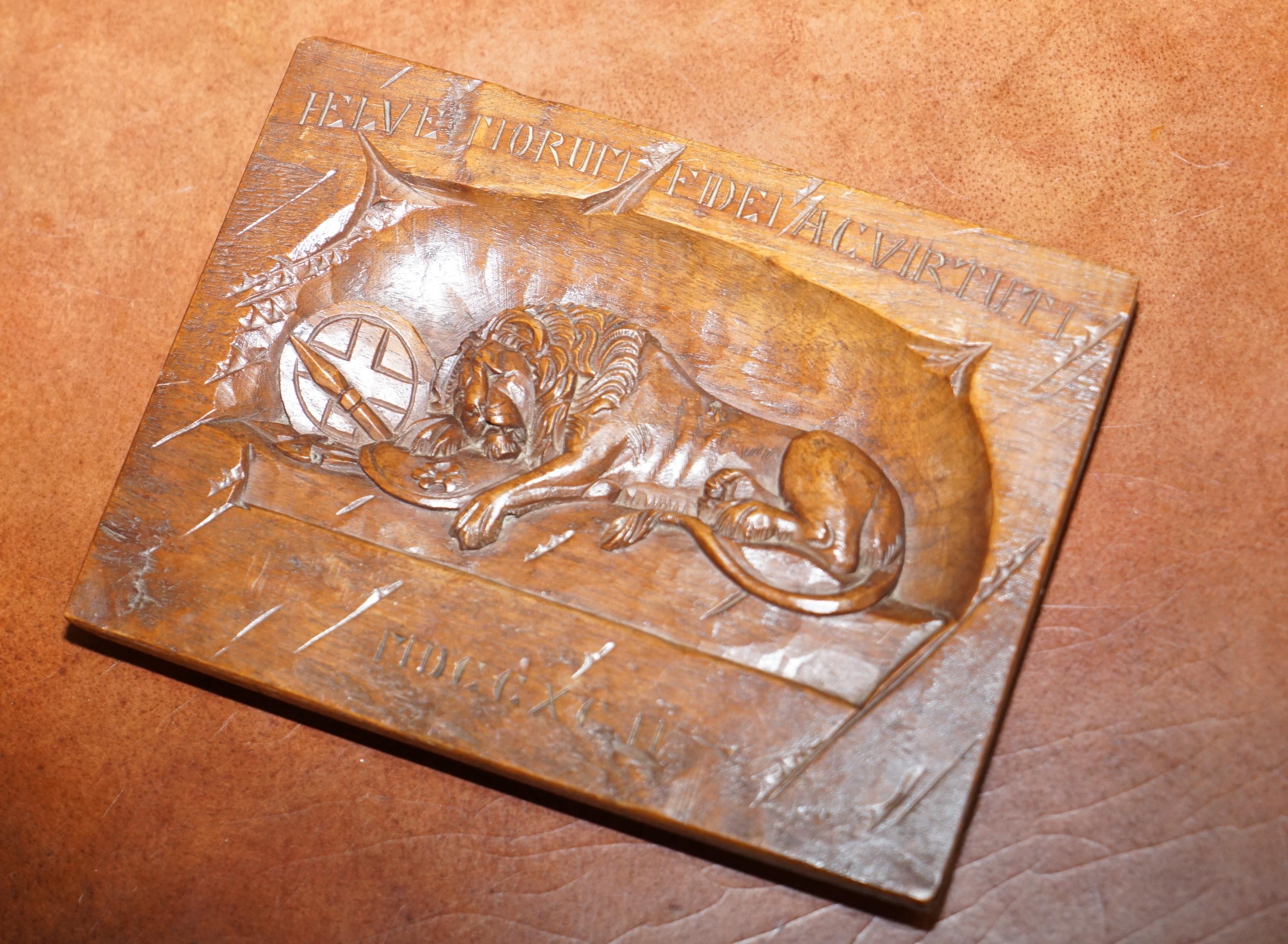 We are delighted to offer for sale this lovely hand carved wall plaque of The Lion of Lucerne and documentation

A very good looking and well made piece, it comes complete with some newspaper cuttings explaining what this is 

This plaque is a