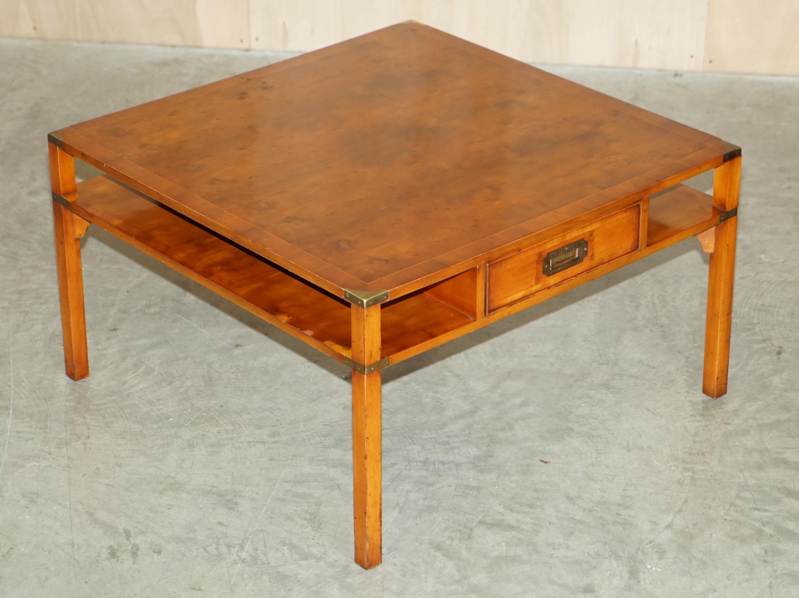 We are delighted to offer this lovely condition, Burr Yew Wood, Military Campaign style coffee table side side bookcase shelves 

This is a very well made and versatile piece with a timber patina to die for, I have never seen one before with the