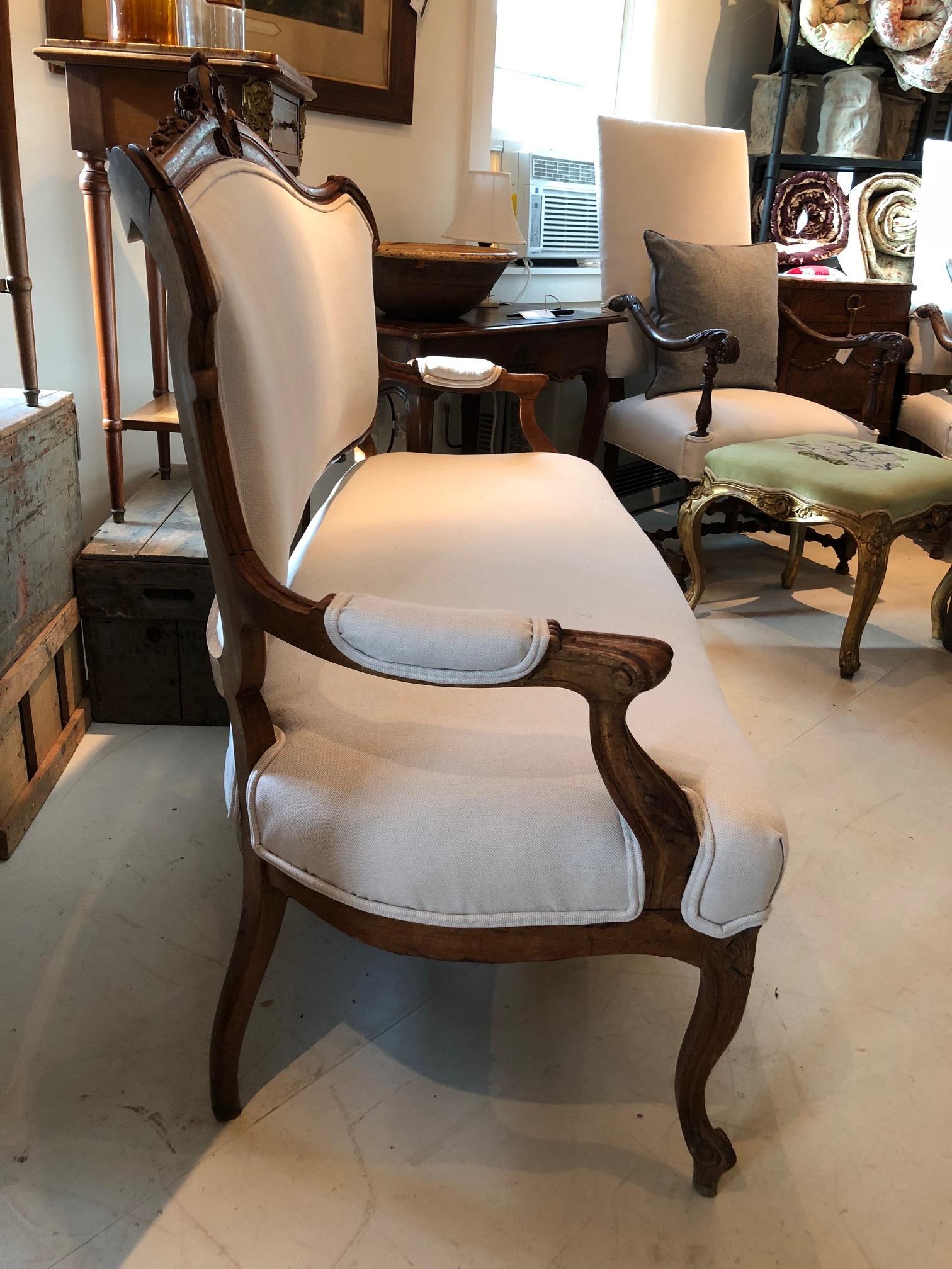 Sublimely Elegant Early French Carved Wood Sofa with New Upholstery (Louis XVI.)