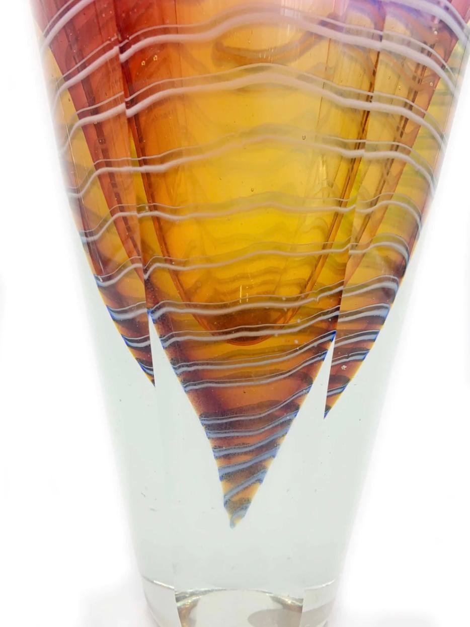 Pink and orange sommerso glass vase with multicolored streaks, made by Cenedese in the 1950s

Measures: Ø cm 14 H cm 25

Simone Cenedese has been producing artistic objects in the glass factory that bears his name since 1946. He belongs to the