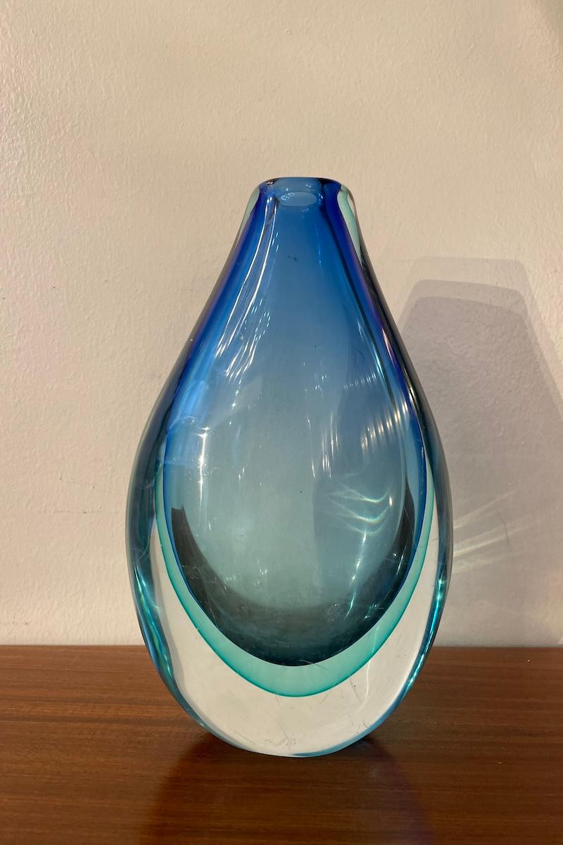 Vase made with the blue-blue submerged glass technique. 
This beautiful object was made by Flavio Poli for Seguso. 
Excellent condition.

Measurements: 16 cm x 9 cm x H 27 cm.

Price INCLUDES the costs for any packaging and crates needed to protect