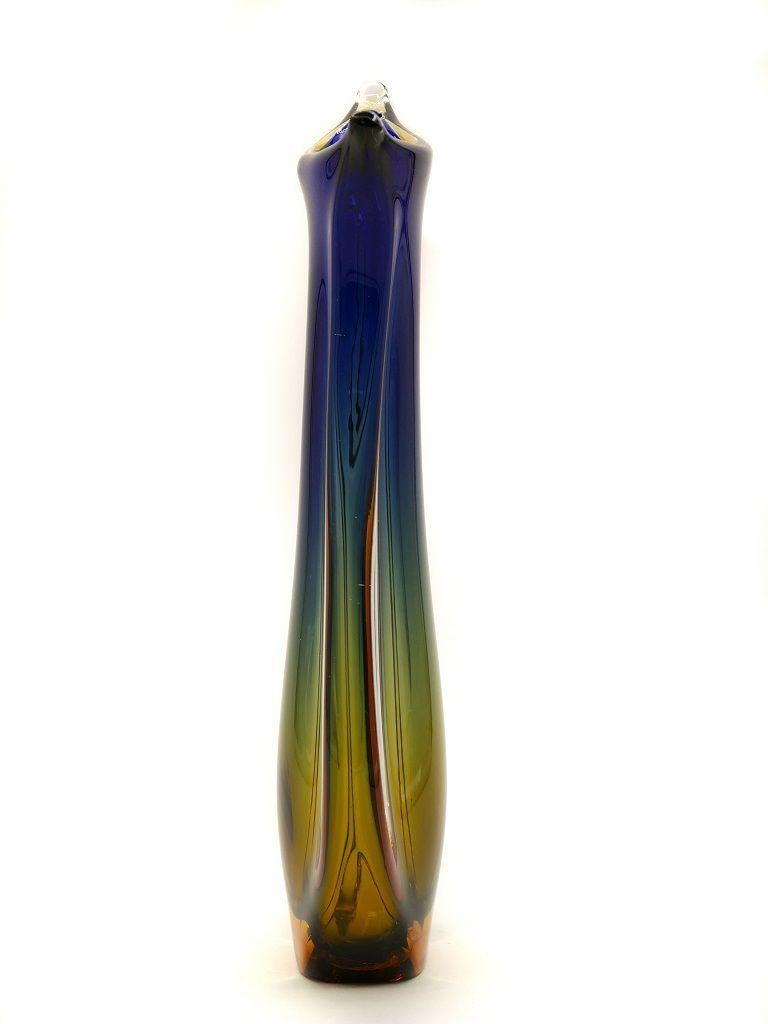 This Submerged Murano vase is a splendid decorative object realized in Italy circa 1960s, likely designed by Flavio Poli, one of the most famous Italian designers of glassware.

Beautiful Murano vase realized with the Sommerso technique.

In