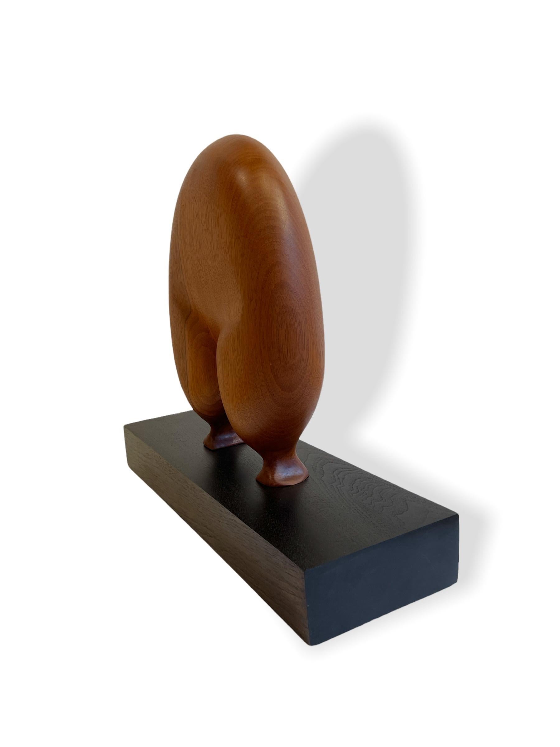 American Submission, Mahogany, Hand Carved Wooden Sculpture on Dark Base