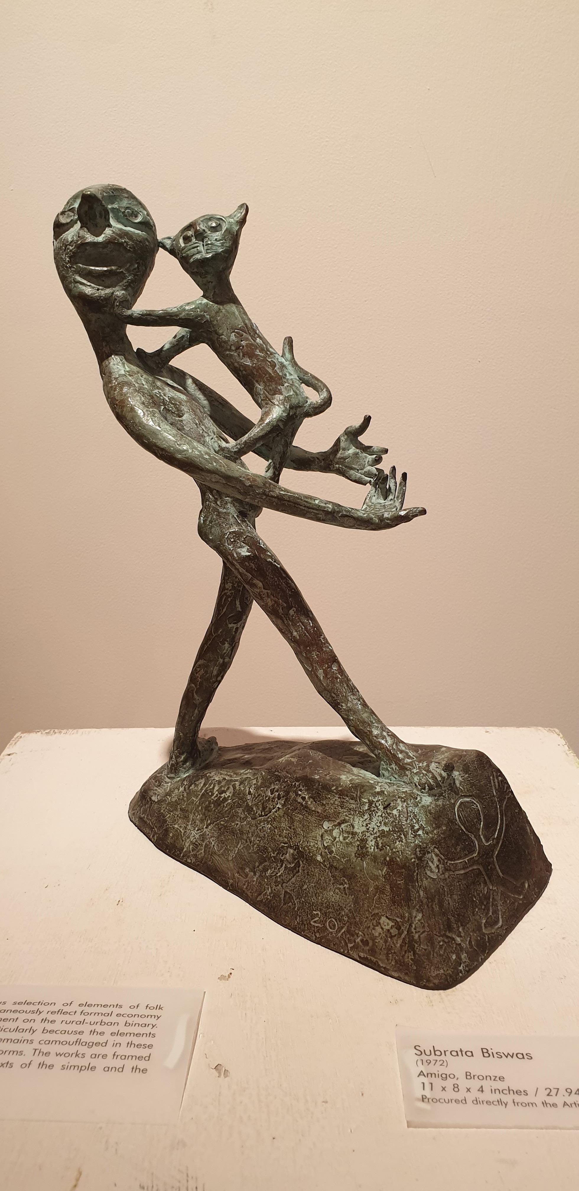 Subrata Biswas - Amigo - H: 11 Inches x W: 8 Inches X D: 4 Inches
Bronze Sculpture.

Subrata Biswas’s three sculptures ‘Think Green’, ‘Amigo’ and ‘City Bred’ a conscious selection of elements of folk forms simultaneously reflect formal economy and a