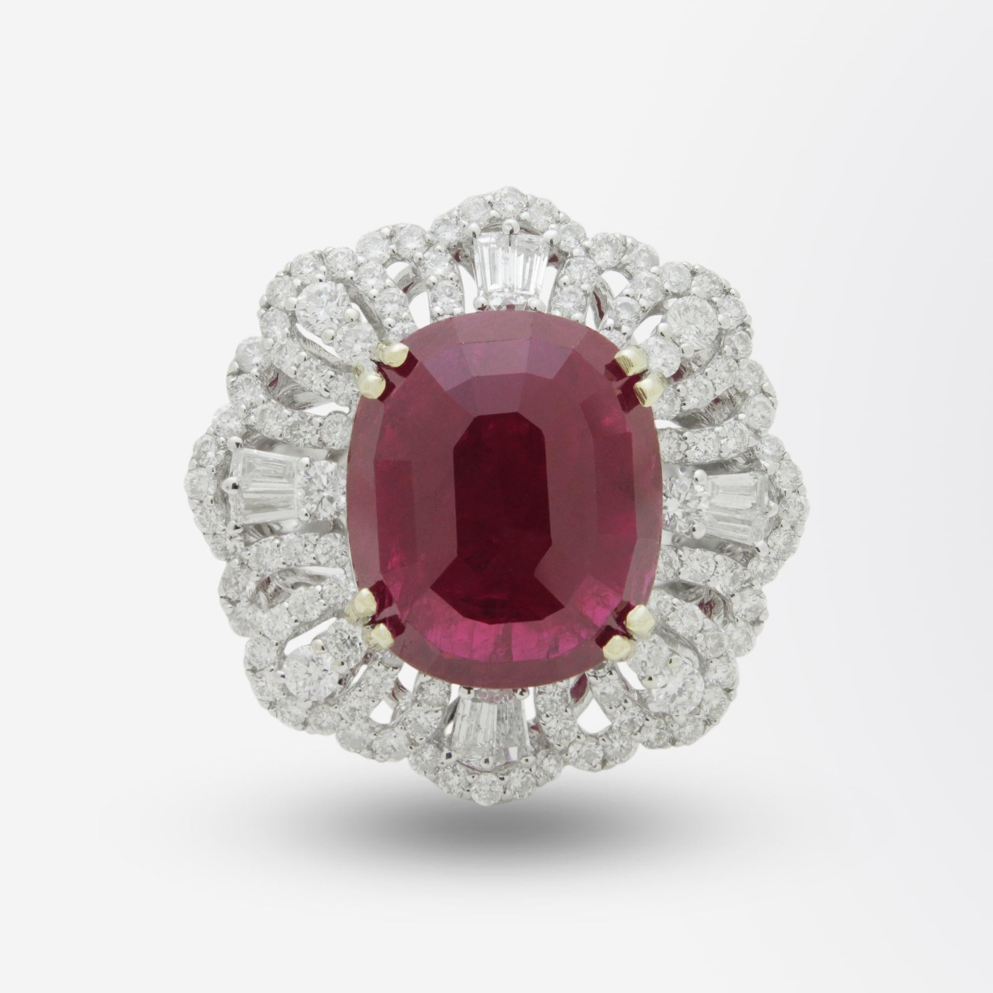 An exceptional ruby and diamond ring set in 18 karat white gold. The dress ring centres on a large GIA certified ruby which is an estimated 8.95 carat that is described as 'dark red heavily included' and shows signs of being heat treated with some