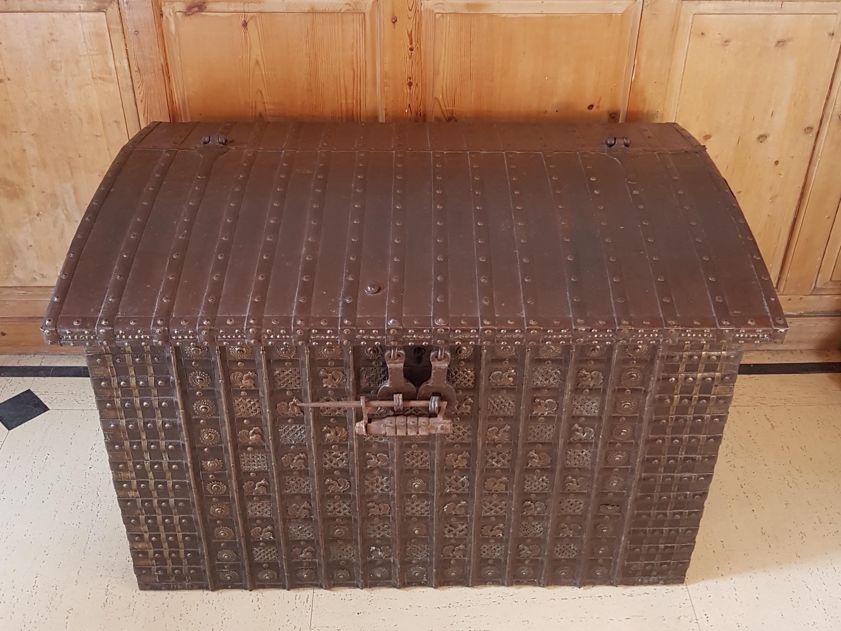 A very substantial Indian dowry chest in teak and rosewood, very decorative metal repoussé work featuring peacocks, extremely rare to find the original lock still attached, large carry side handles, bottom internal drawer, huge storage space. Teak