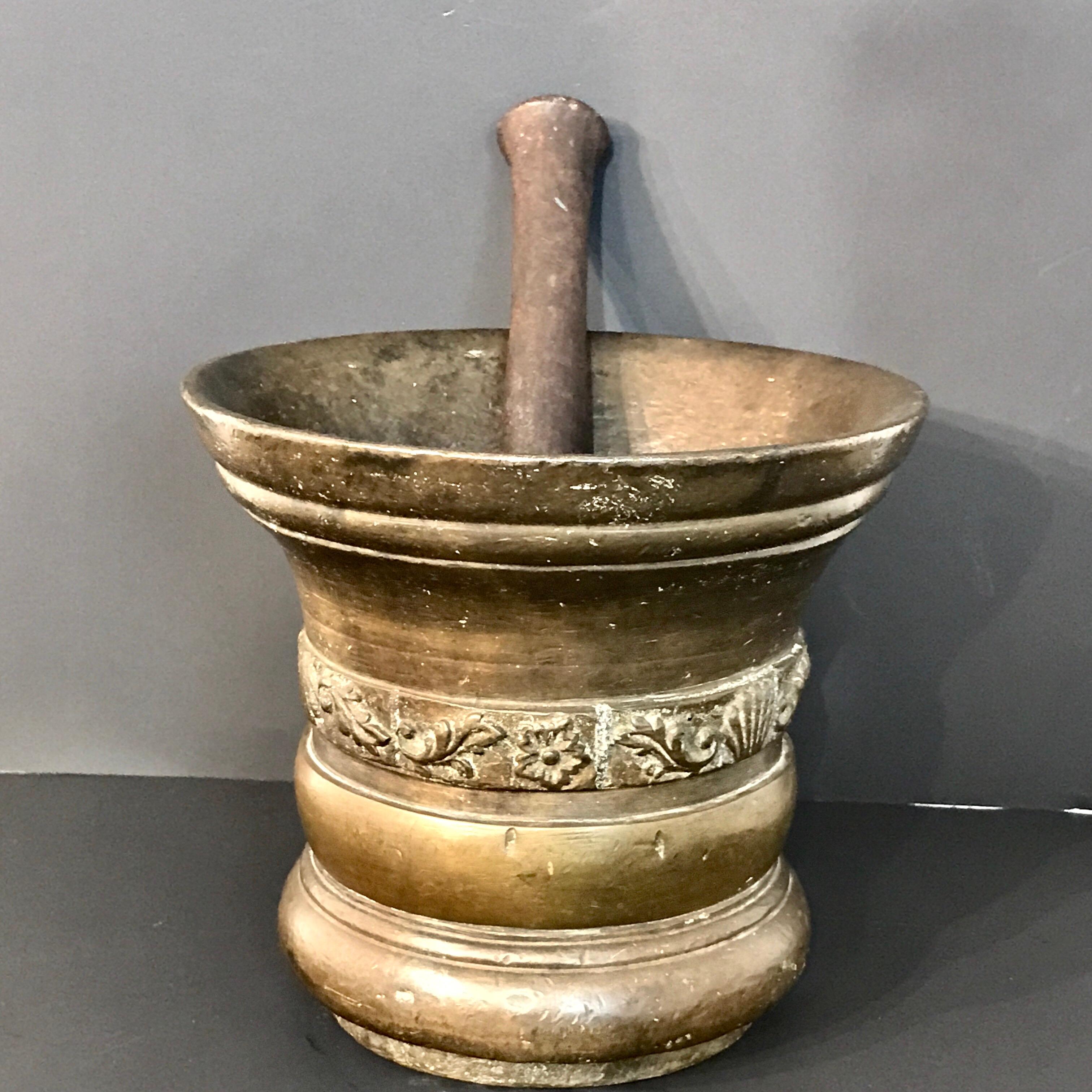 Substantial antique Italian bronze mortar and pestle, finely cast with shell and floral band, complete with 12
