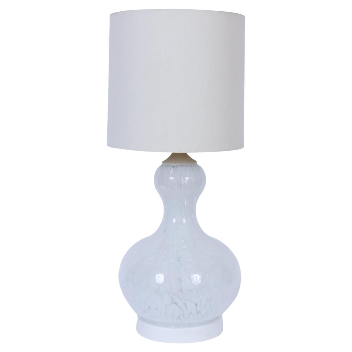 Large Carlo Nason Mazzega attributed handblown Mottled Murano table lamp. Featuring a large, handcrafted Murano Glass gourd form with luminescent white on white translucent design on white circular base. 26 H top of socket. 21 H top of glass. Shade