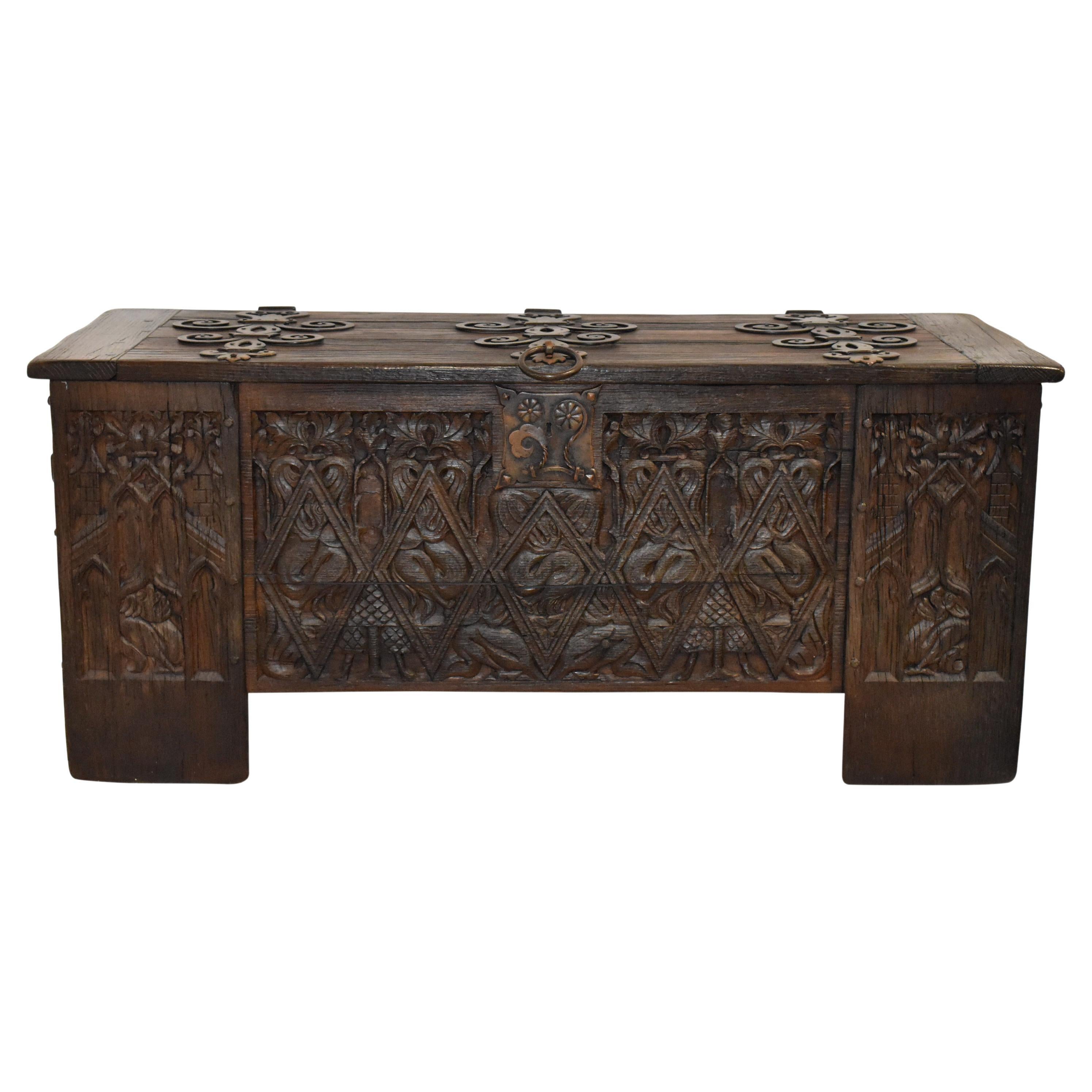 Substantial Carved Oak Trunk with Iron Accents For Sale