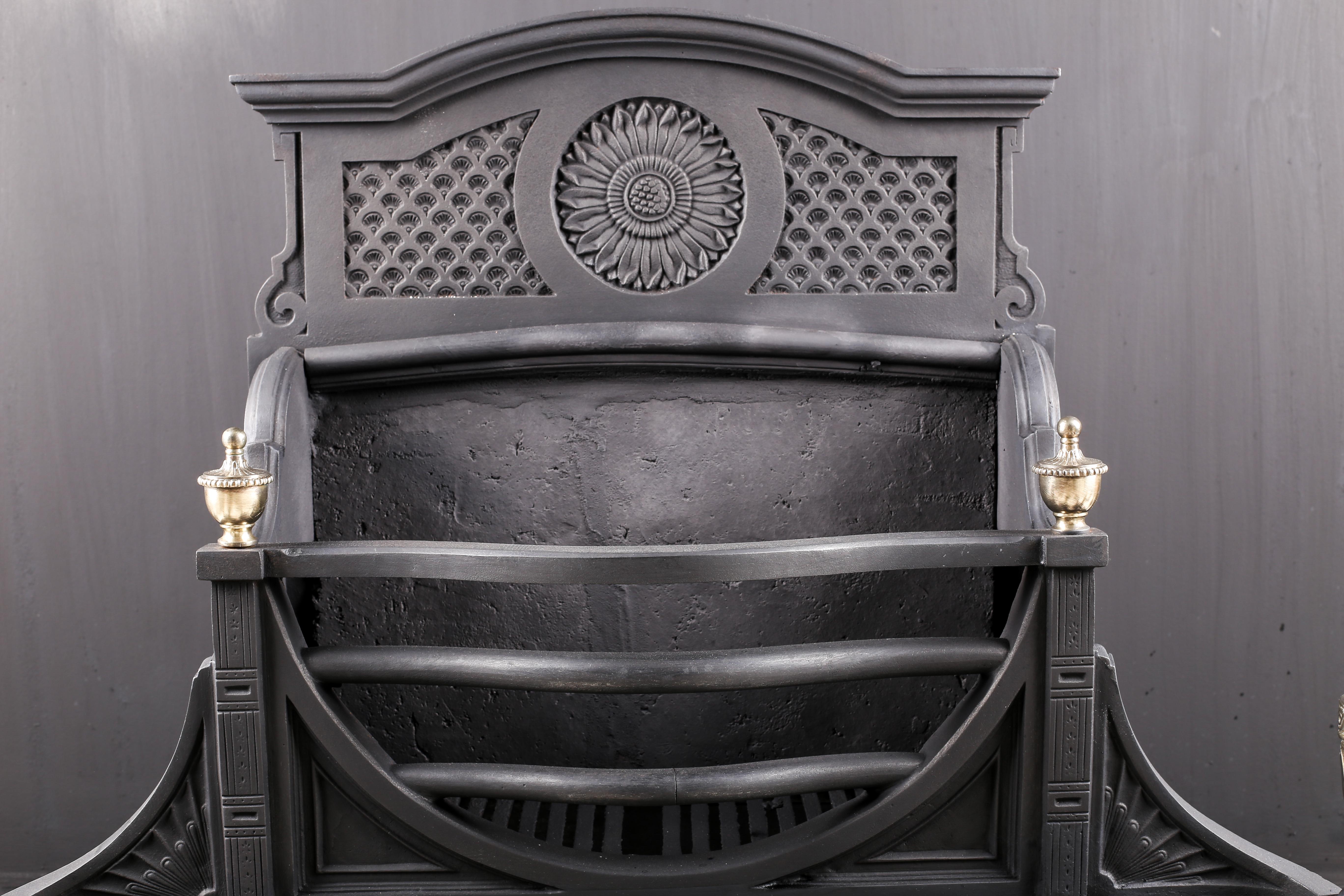 A substantial cast iron and brass late Georgian fire basket with a Sun Burst, English, circa 1870.

Measures: Depth 15