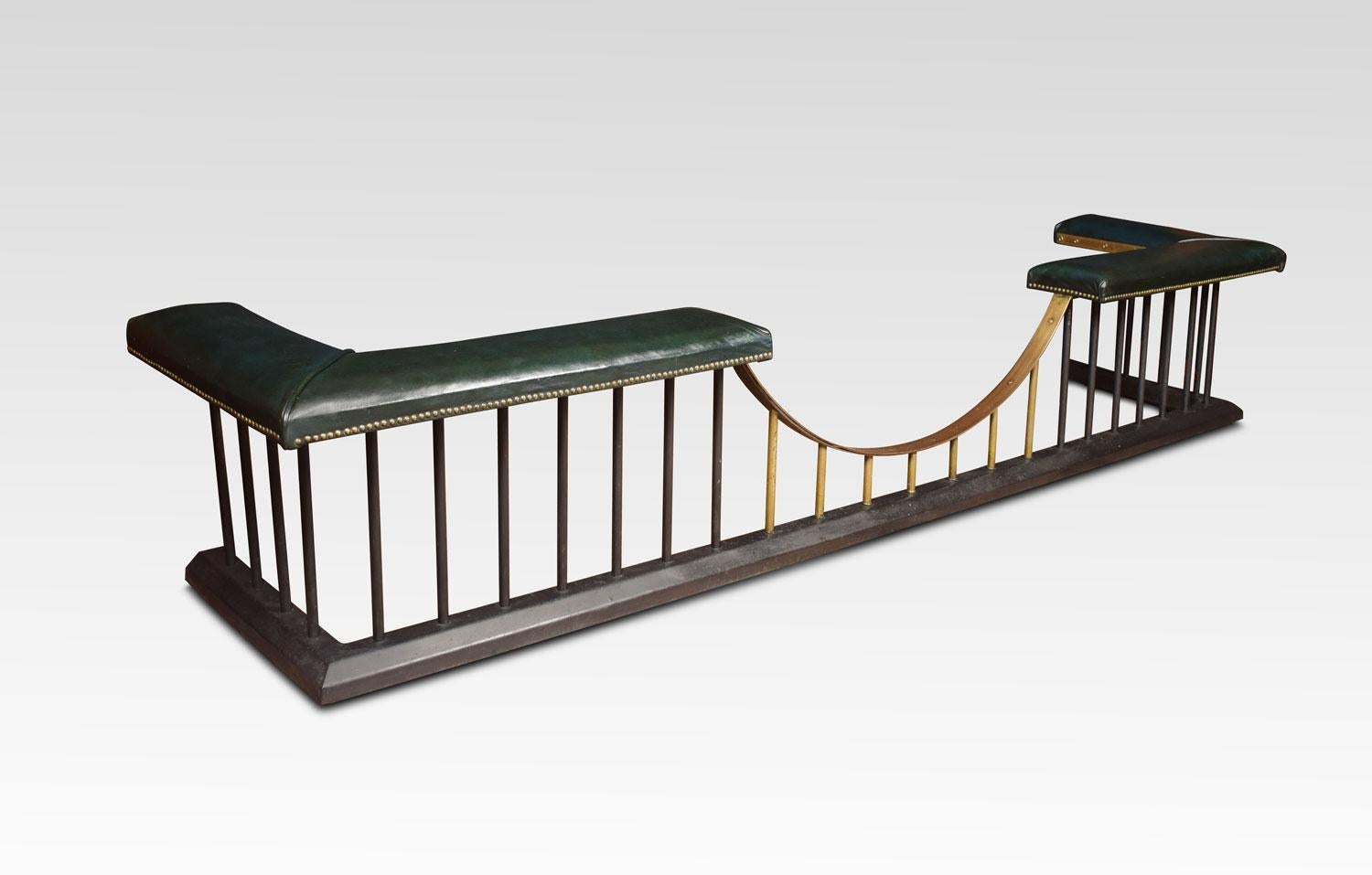 Brass and steel club Fender, of very large proportions. The green leather upholstered seats, resting on tubular sports. All raised up on moulded platform base.
Dimensions:
Height 21 inches
External measurements:
Length 123 inches
Depth 26.5