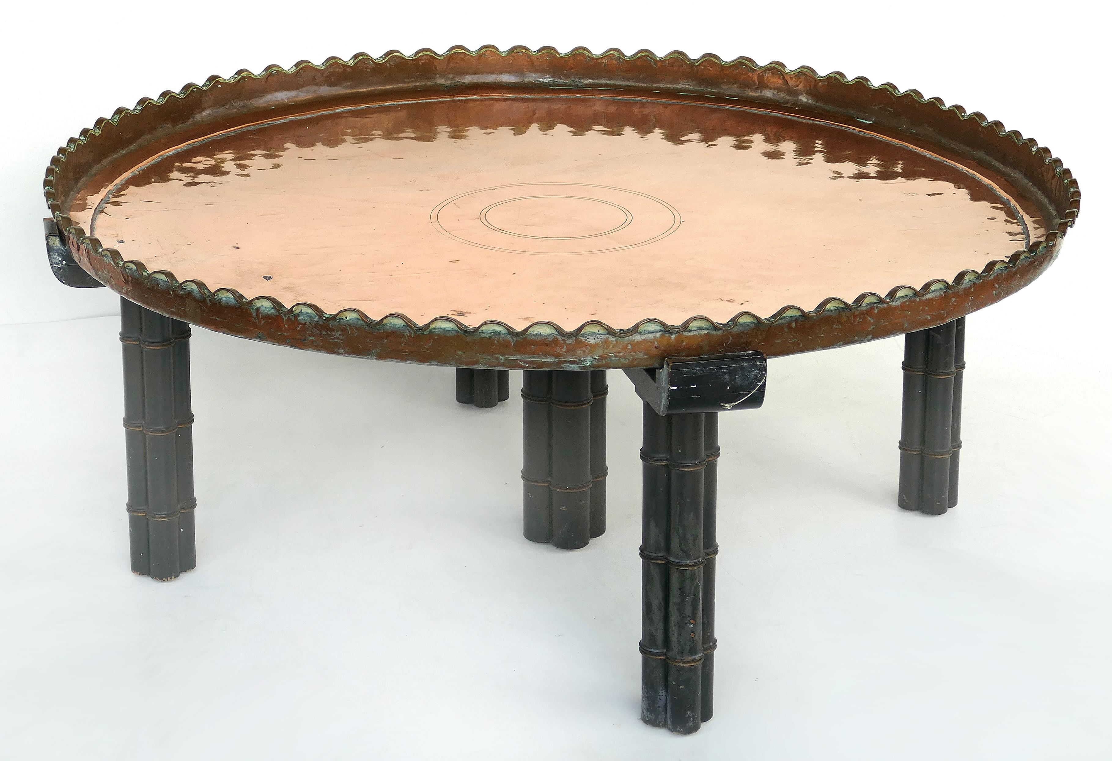 Substantial copper tray table on wood stand

Offered for sale is a substantial copper tray table with scalloped edges which is supported by a faux-bamboo carved wooden base. The table is large and the removable copper tray is quite heavy. The