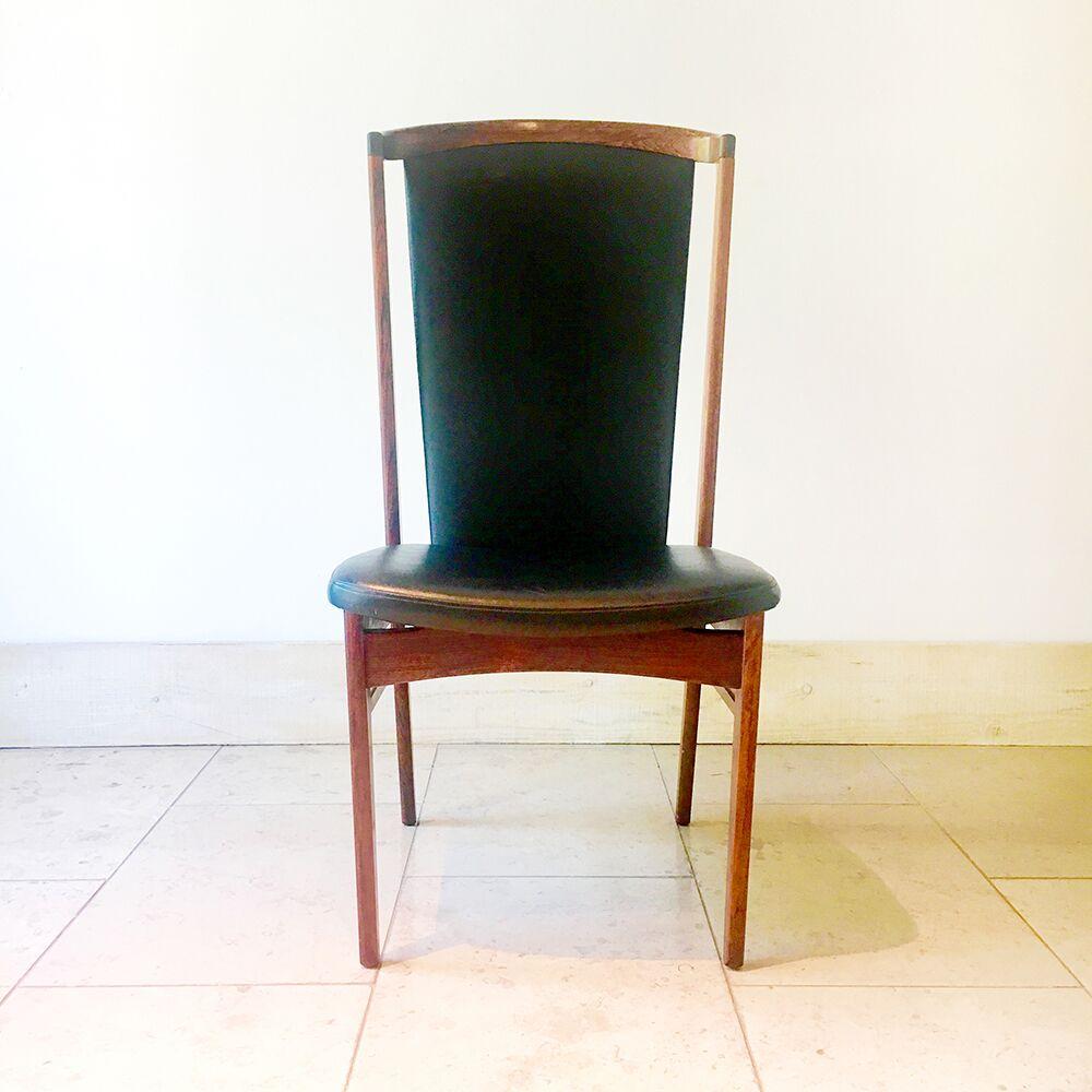 Substantial Danish faux black leather upholstered desk chair designed by Eric Buck (Buch) for Erik Christensen, 1960s.

Erik Buck was born in 1923 and like many of his Danish contemporaries, worked fabric and leather with grained woods. He is one