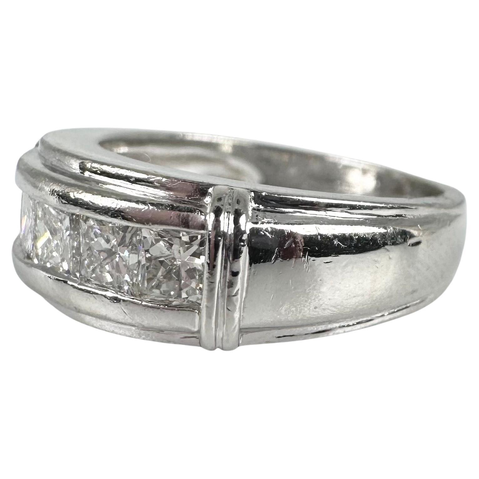 Luxurious wedding band made in platinum with natural diamonds. This ring is grand at over 8 grams and looks very substantial when on finger.

METAL: PLATINUM
NATURAL DIAMOND(S)
Clarity/Color: VS/G
Carat:0.75ct
Cut:Princess Cut