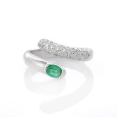 Substantial 18K White Gold Emerald Bypass Ring with Diamonds