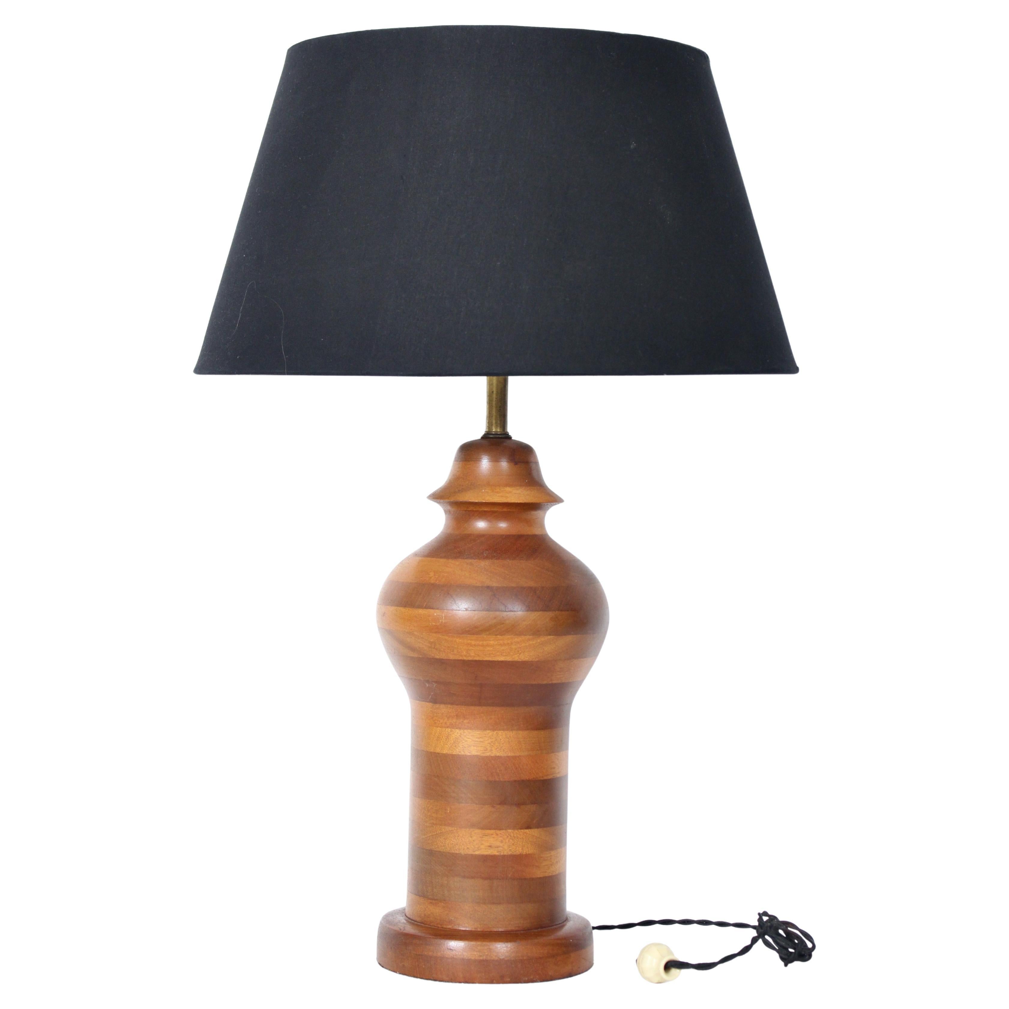 Tall American Craftsman Stacked Mixed Hardwood Ginger Jar Table Lamp. Featuring a large and solid Ginger Jar form, turned hardwood rings in varied tones, atop a rounded circular (7D x 1.63H) base.  Standard socket. 28H to top of Socket. 23H to top