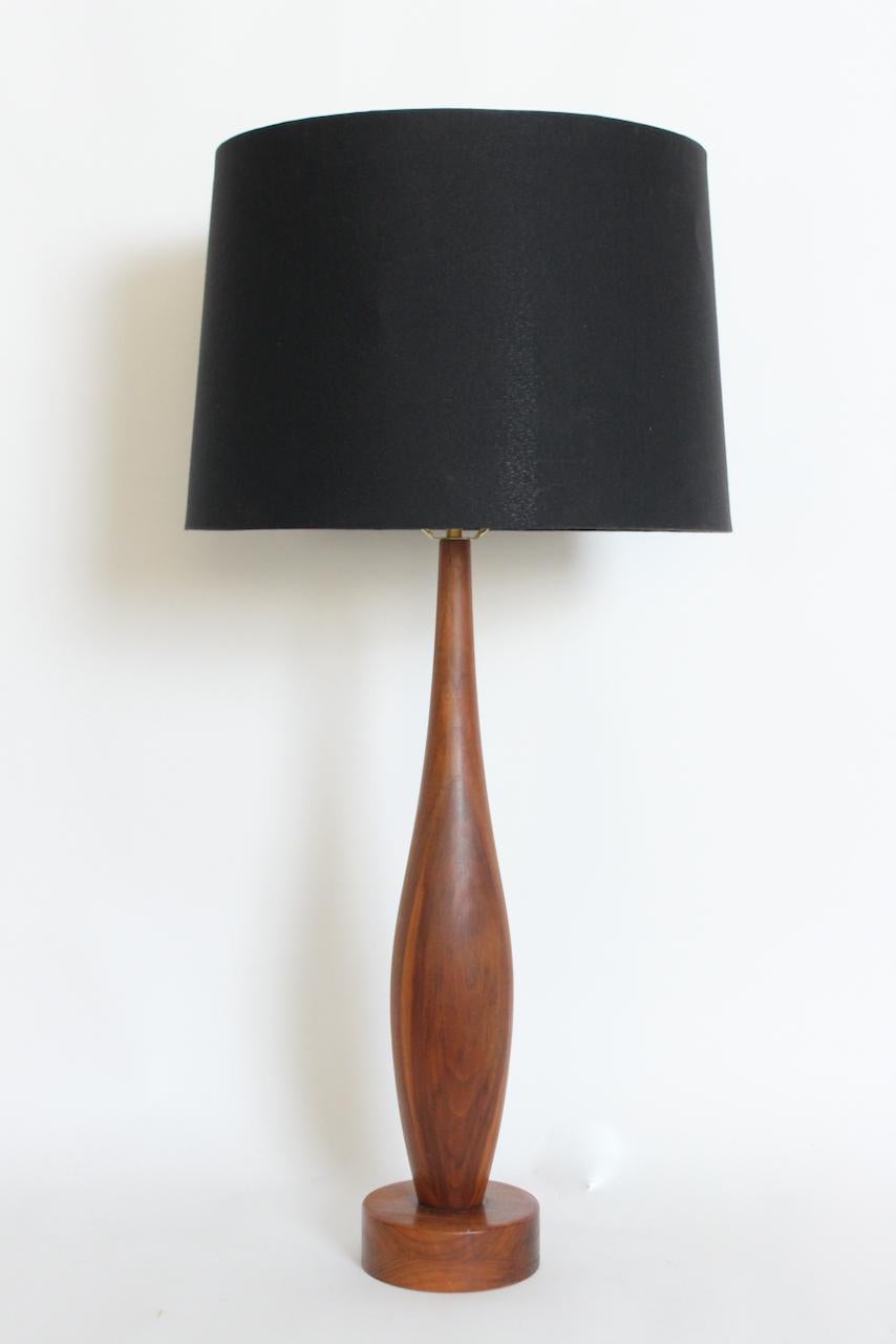 Tall American Mid Century Modern Mel Smilow attributed Walnut Table Lamp. Featuring a hand turned, slender, staved, solid beautifully grained Walnut bottle form (5D), smooth, bulbous center, a top the round (6D x 2H) base. Small footprint. 37 H to