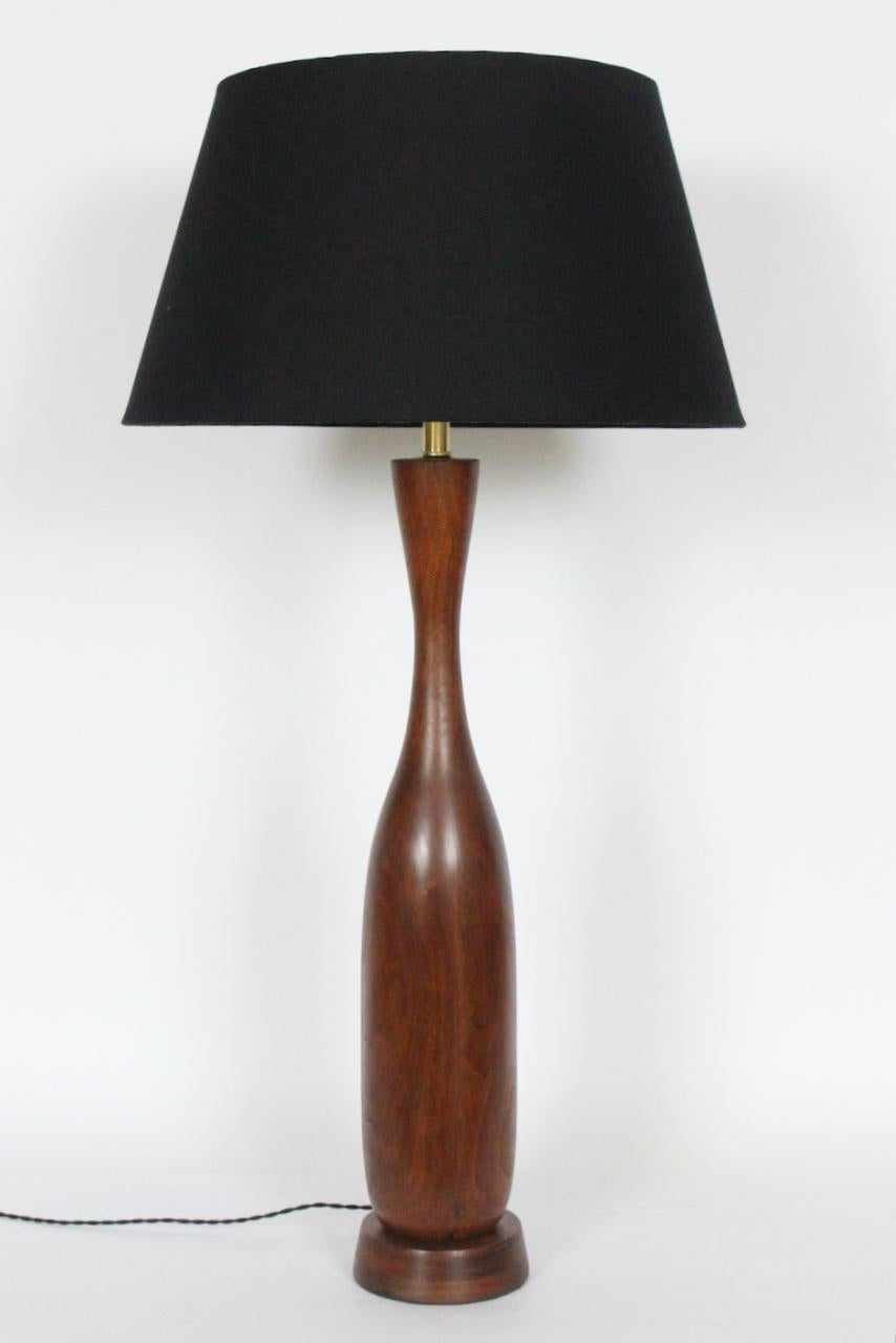 Tall handcrafted New Hope, Pennsylvania School Walnut Table Lamp, in the manner of Phillip Lloyd Powell. Featuring a hand turned, slender, smooth, staved, solid beautifully grained Walnut bottle form (5D), with flared neck, a top the round (6D x