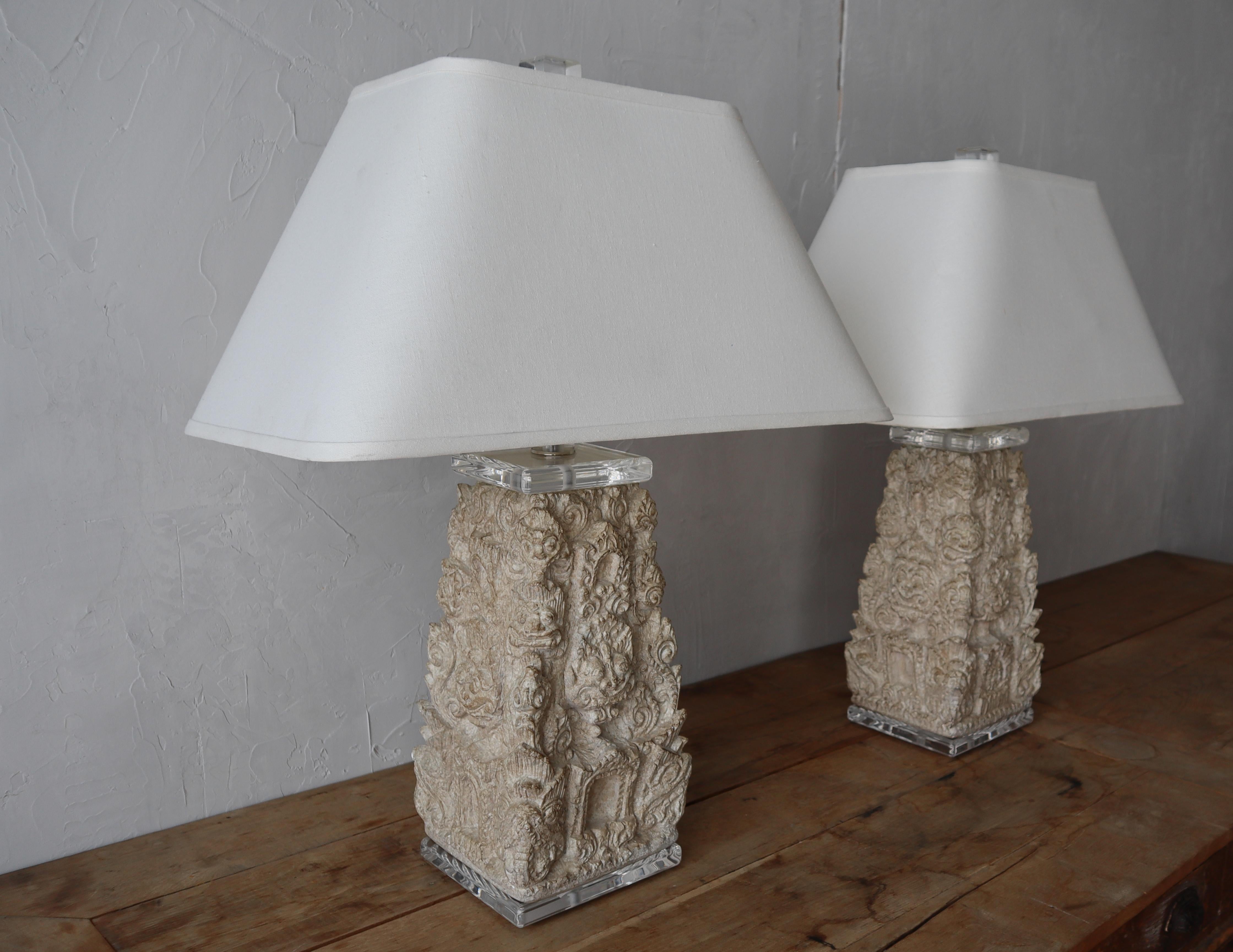 This pair of carved stone and lucite Foo Dog lamps is nothing short of incredible. These lamps are fairly large and heavy. The carved details and lucite accents add lots of depth and texture.

Lamps are in excellent condition with no chips cracks