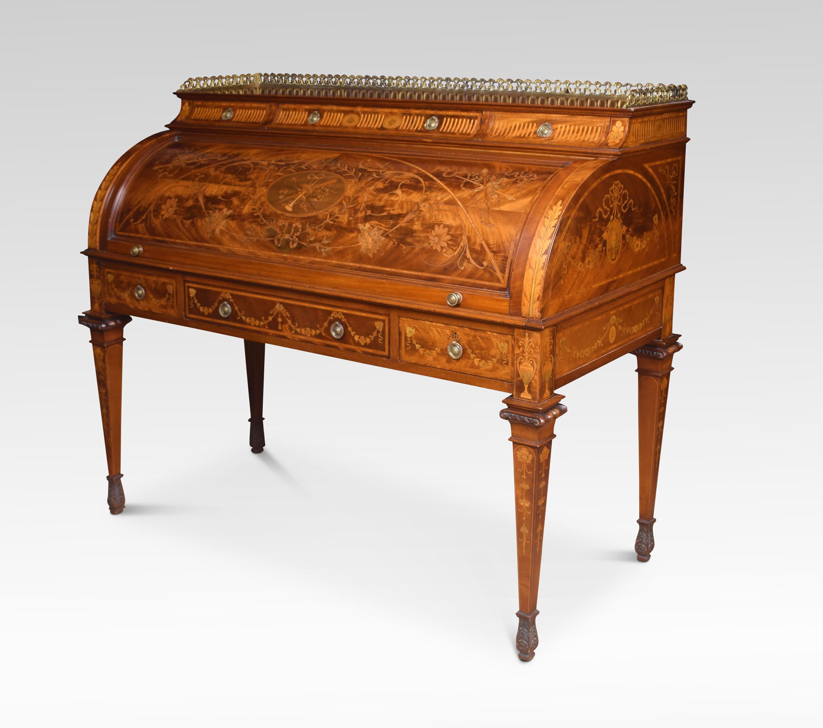 A substantial Sheraton Revival flame mahogany and satinwood crossbanded cylinder bureau, the ornate raised gallery over three cushion frieze drawers with brass tooled handles, above a profusely inlaid cylinder front. The decorative subject matter