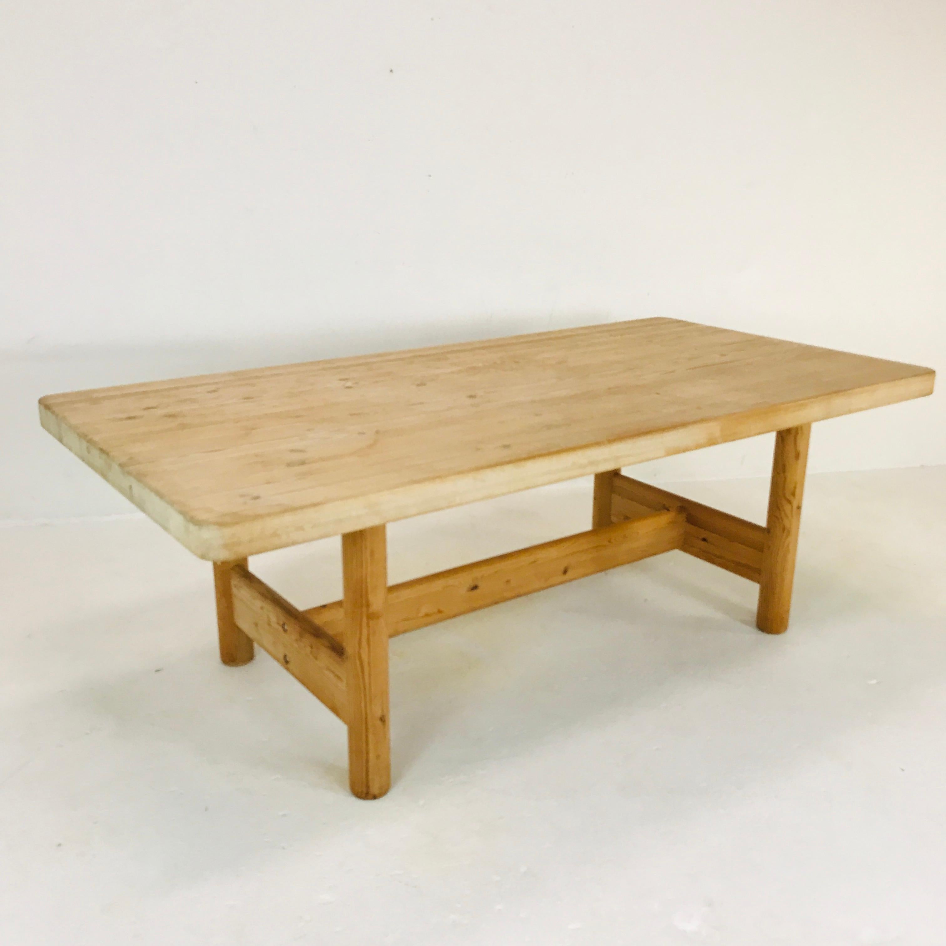 Thick and Heavy solid Scandinavian pine butcher block dining table. Imported to the United States by the original owner in the 1970s. Original natural wood finish - refinishing recommended (tabletop includes some visible scratches and watermarks).